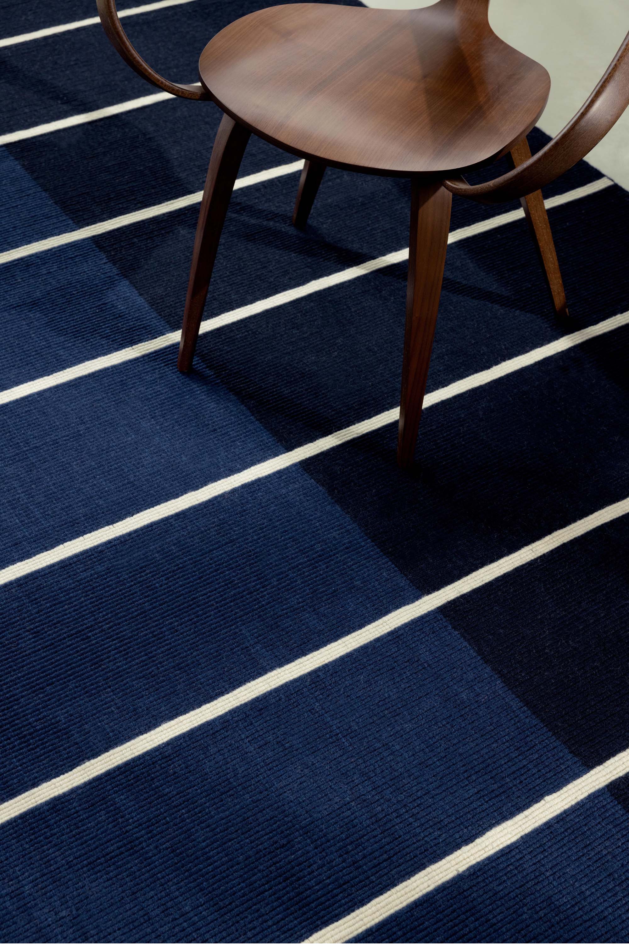 Geometric rug with blue linear pattern