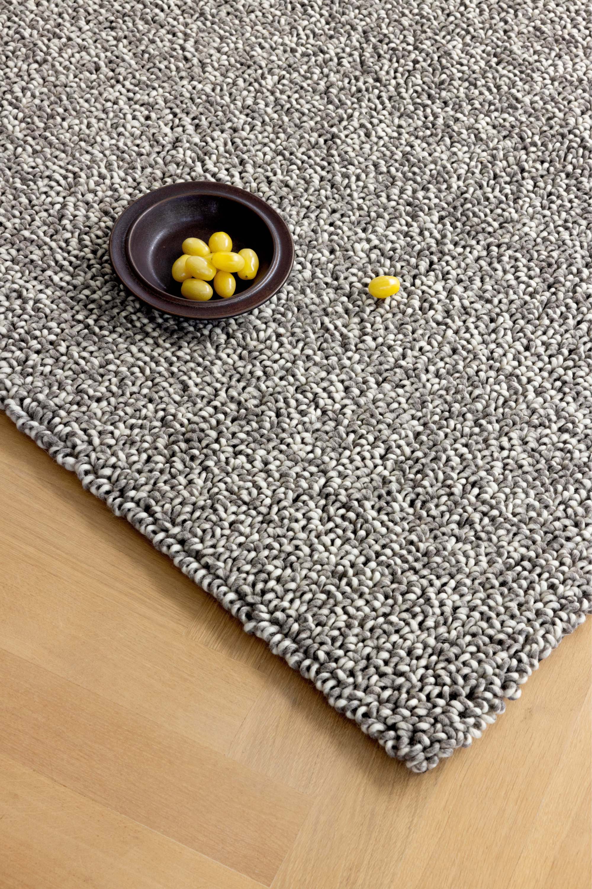 Plain dark grey rug with looped pile