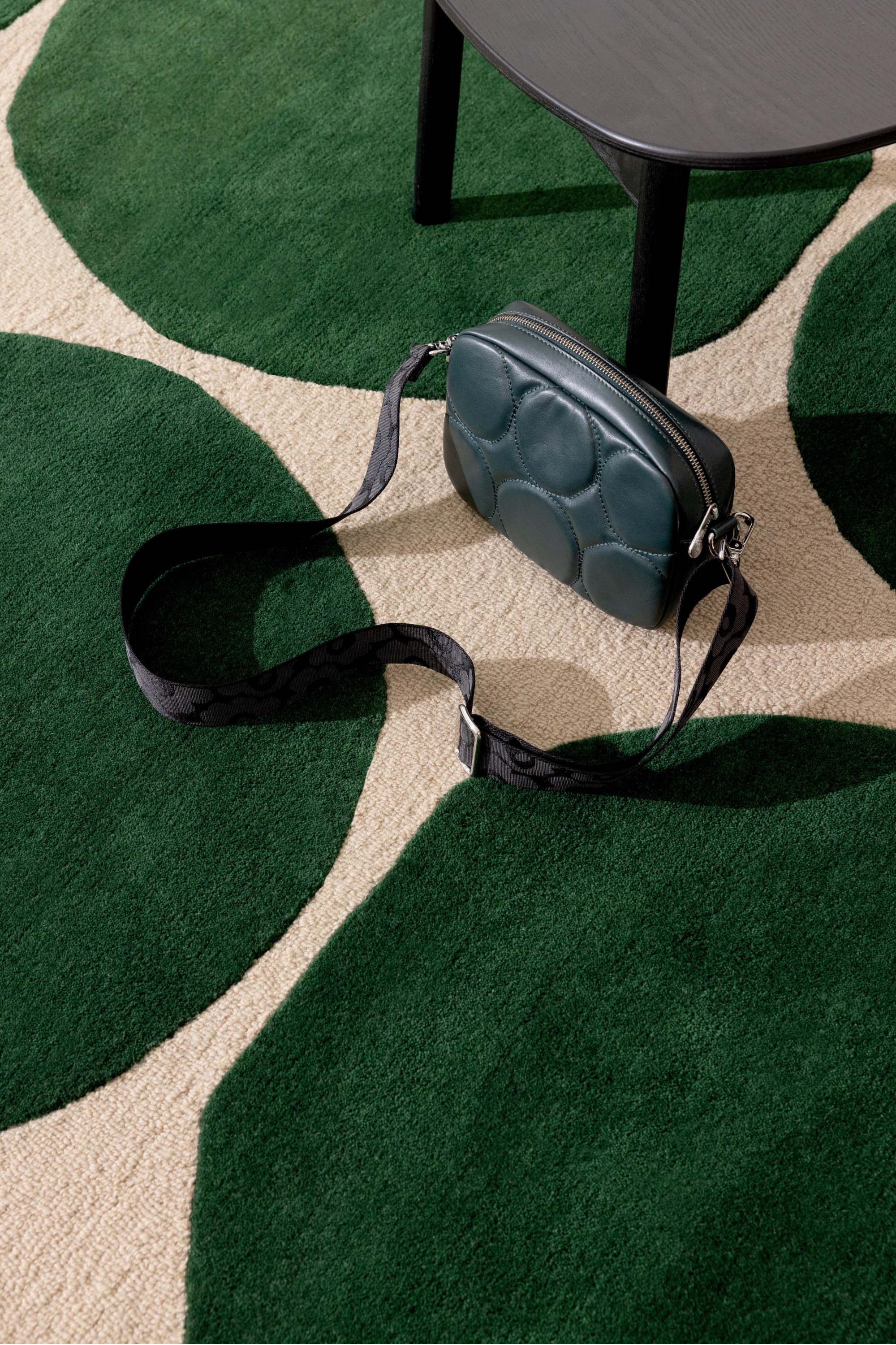 Beige rug with green repeated circle pattern