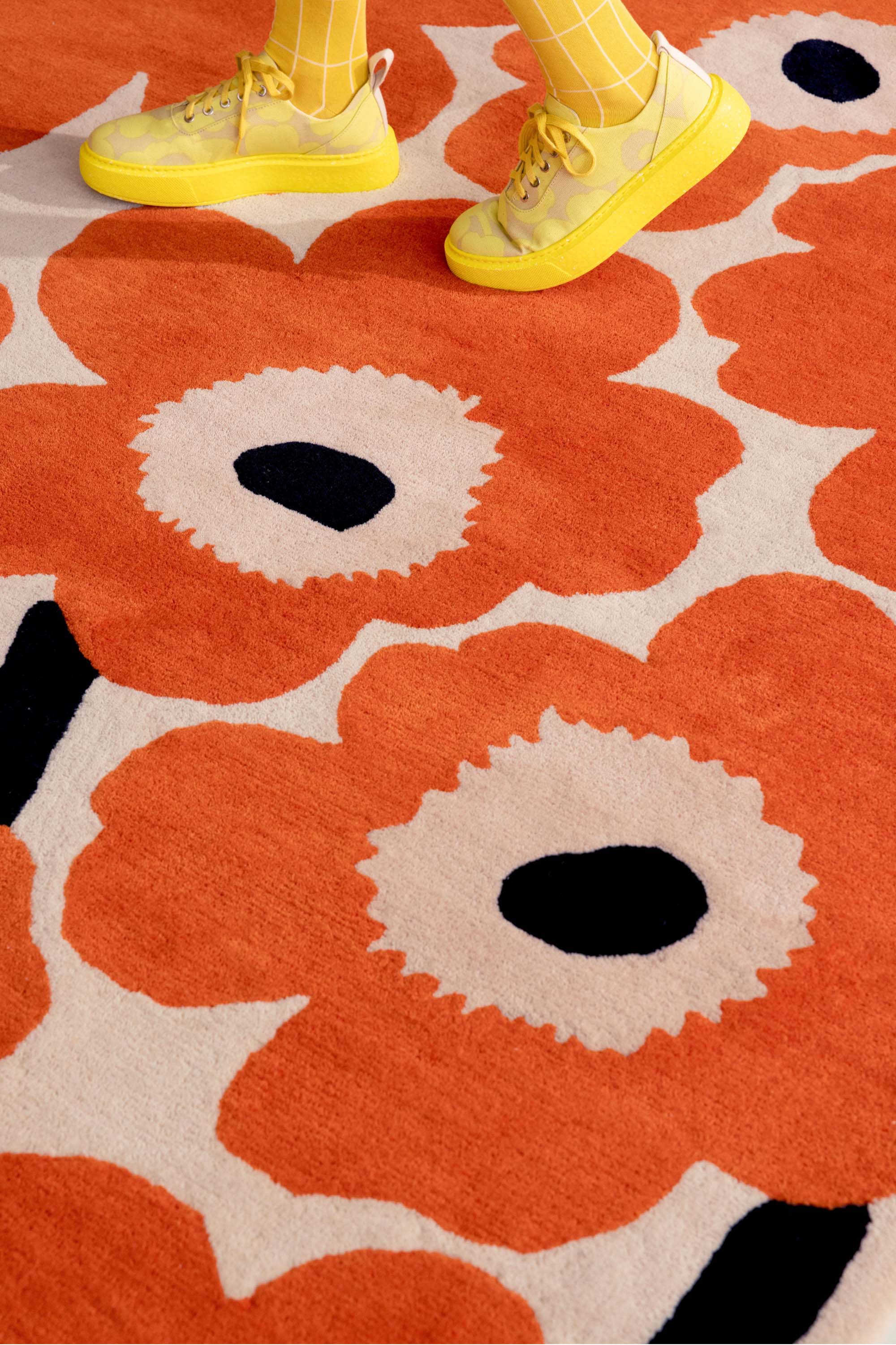 Orange patterned floral rug 