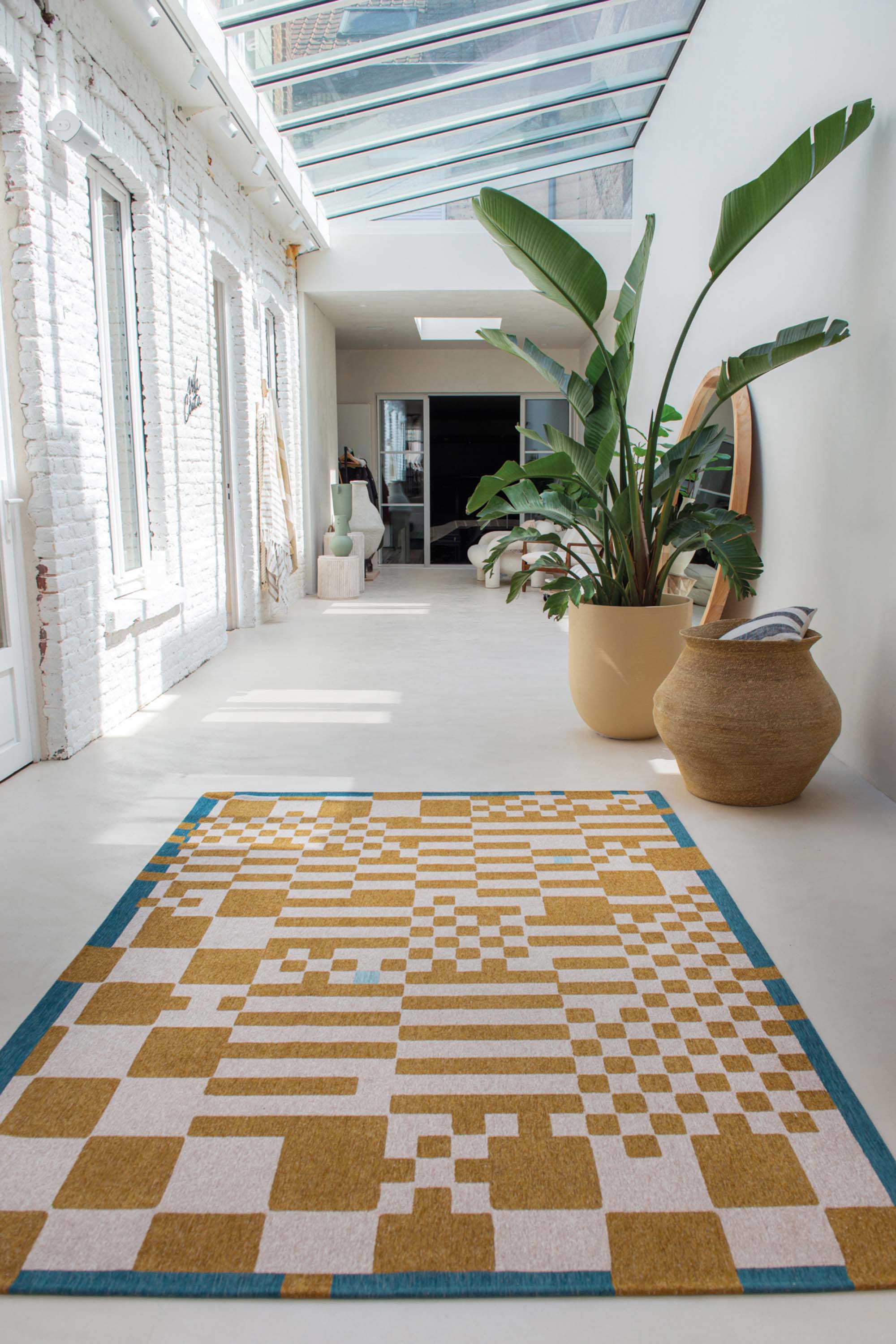 Abstract geometric rug with yellow, green, and white tones