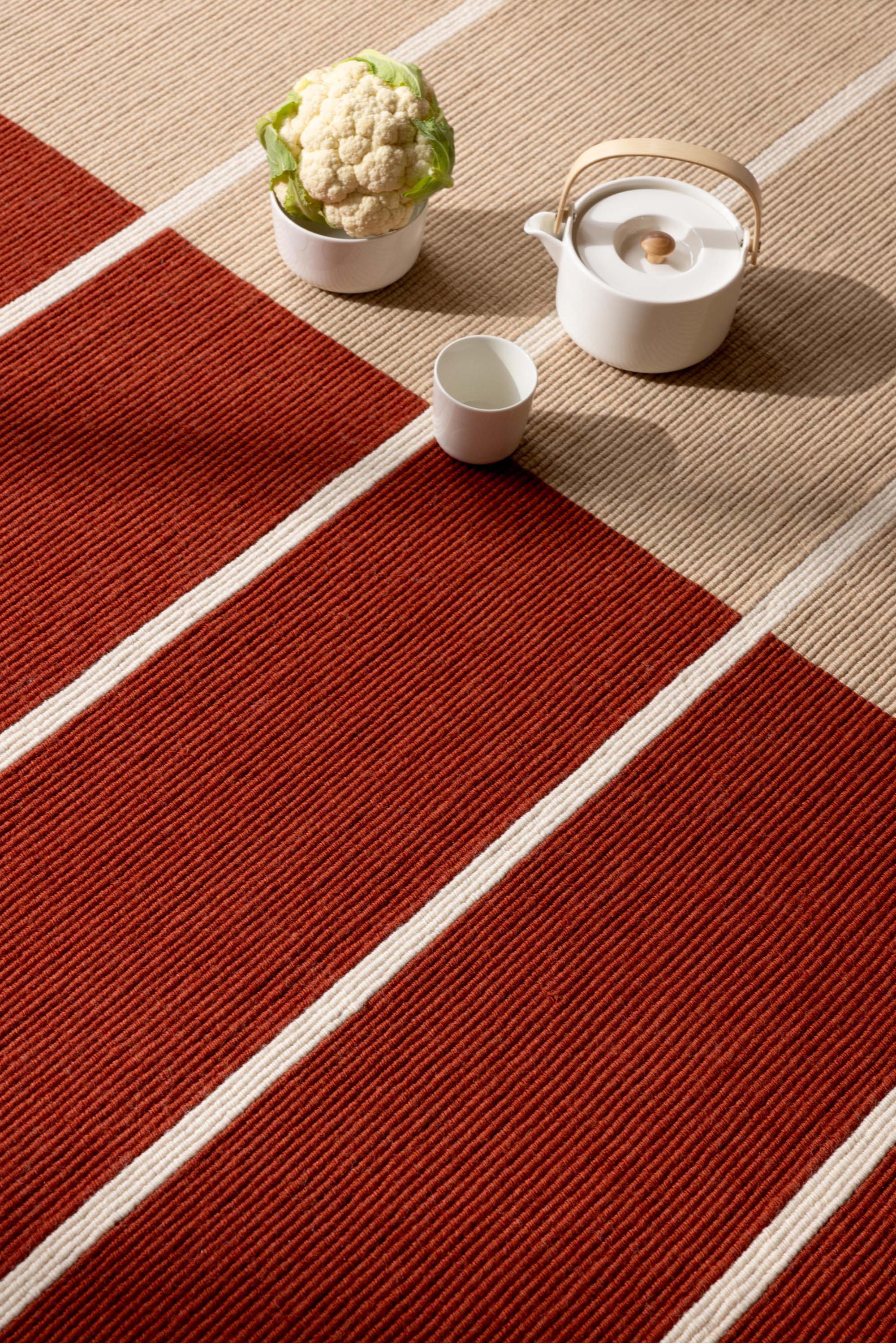 Geometric rug with orange linear pattern