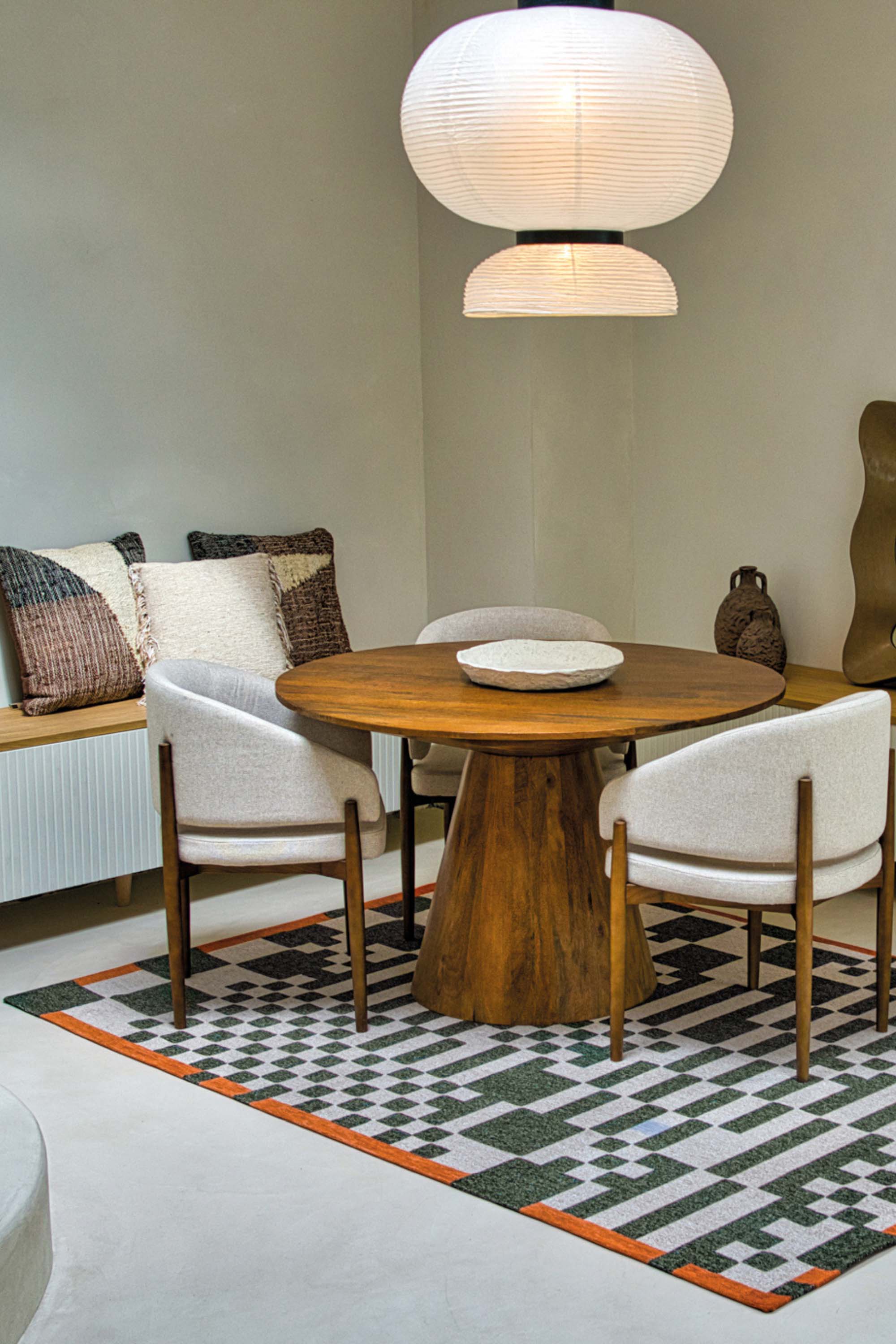 Abstract geometric rug with green, orange, and white tones