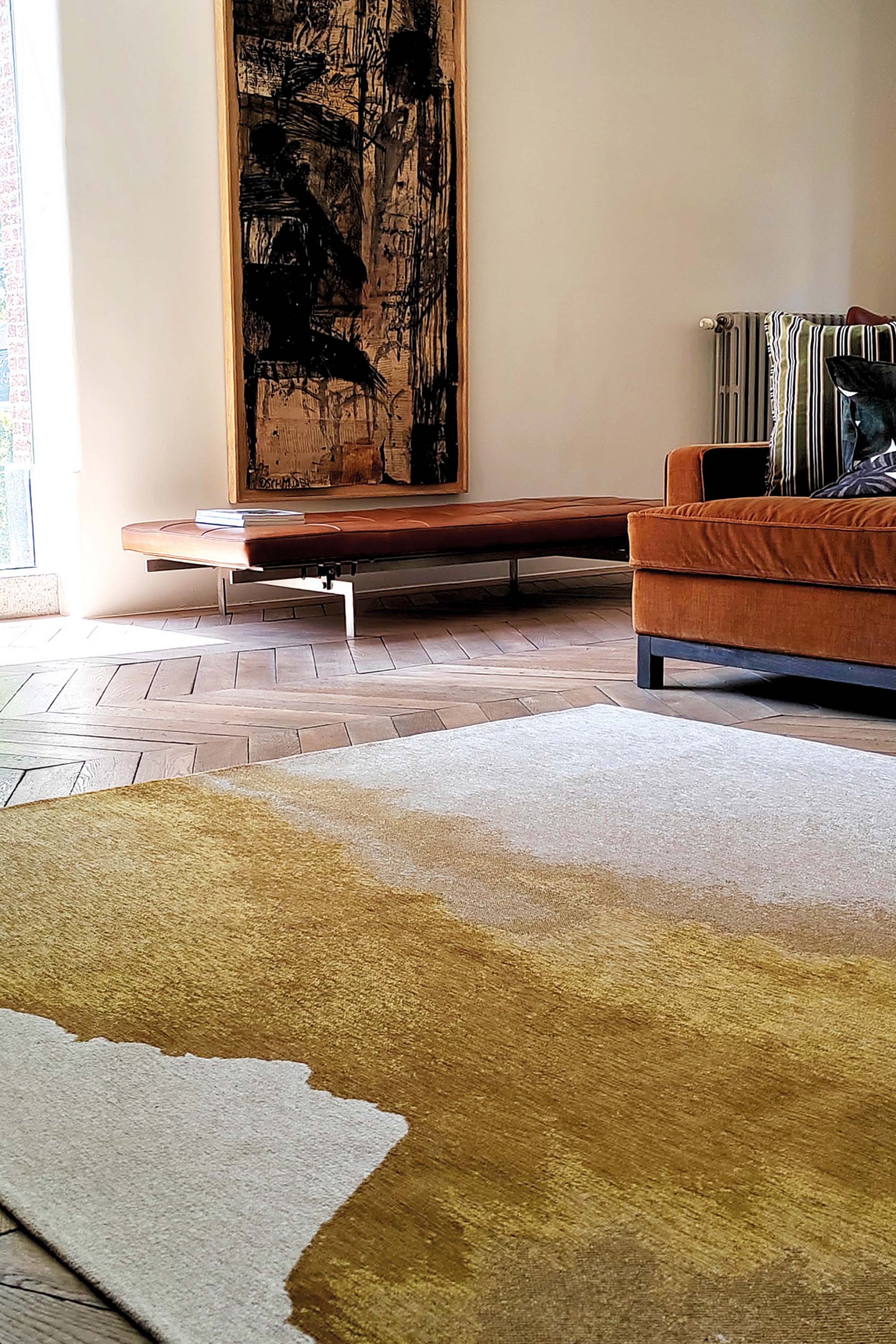 Modern rug with gold abstract shoreline pattern