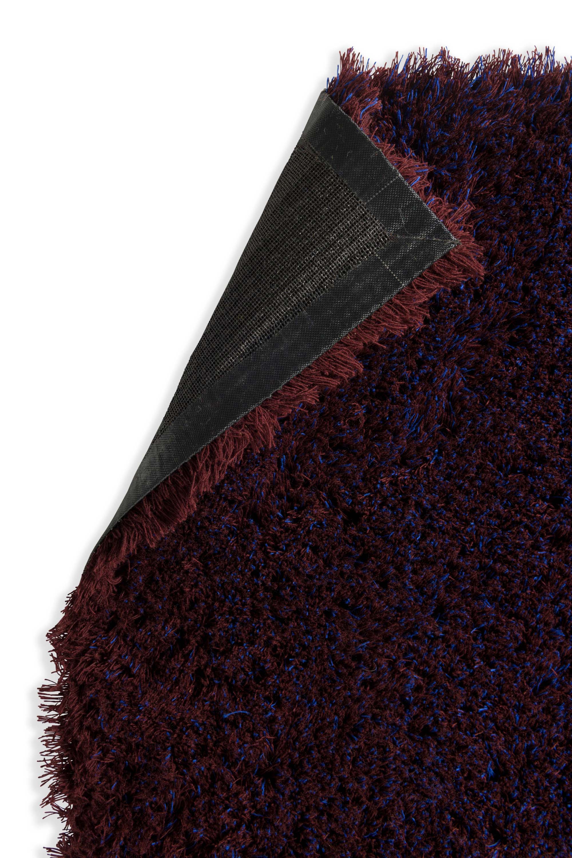 Plain blue rug with shaggy pile