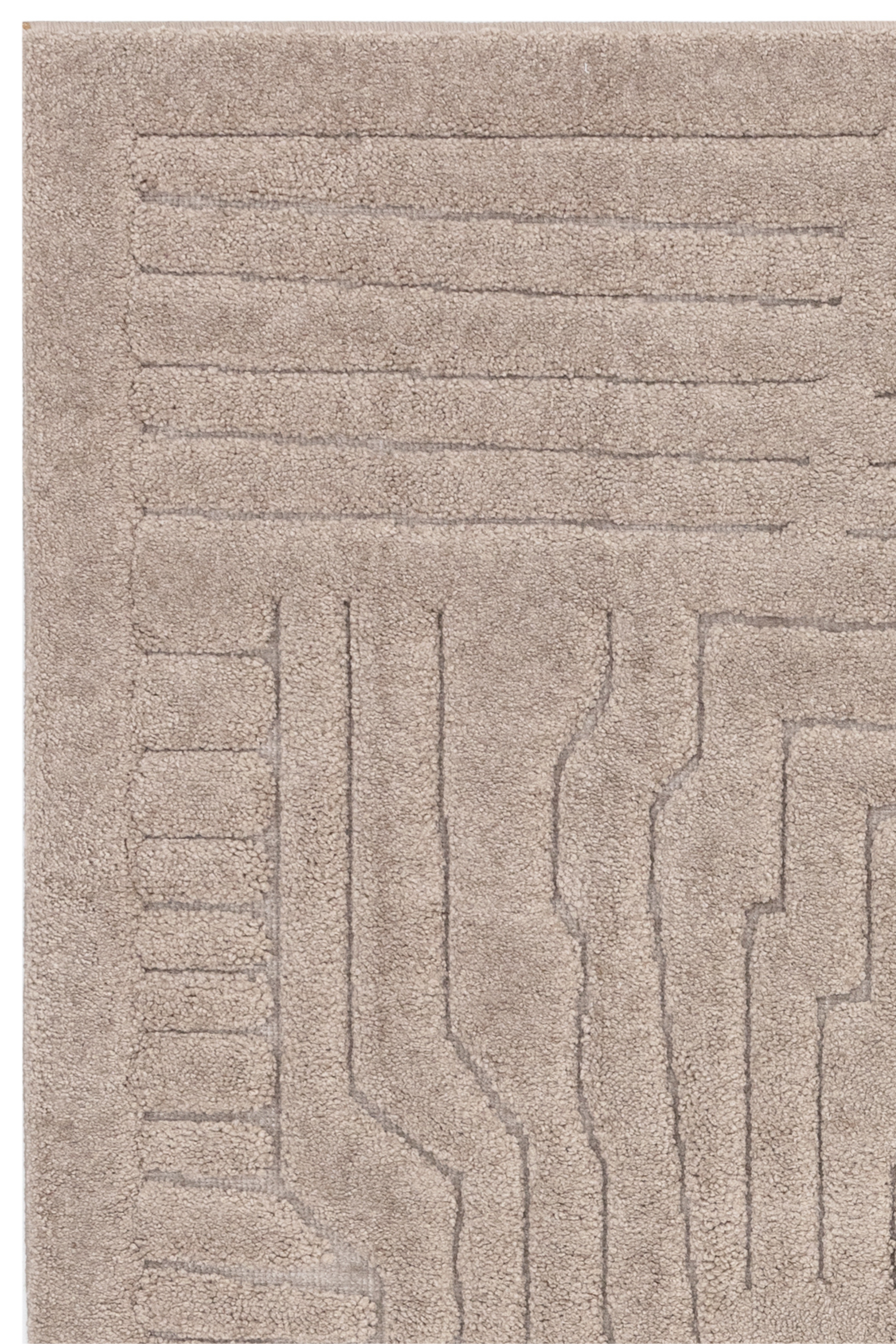 Beige rug with high-low pile and minimal geometric pattern