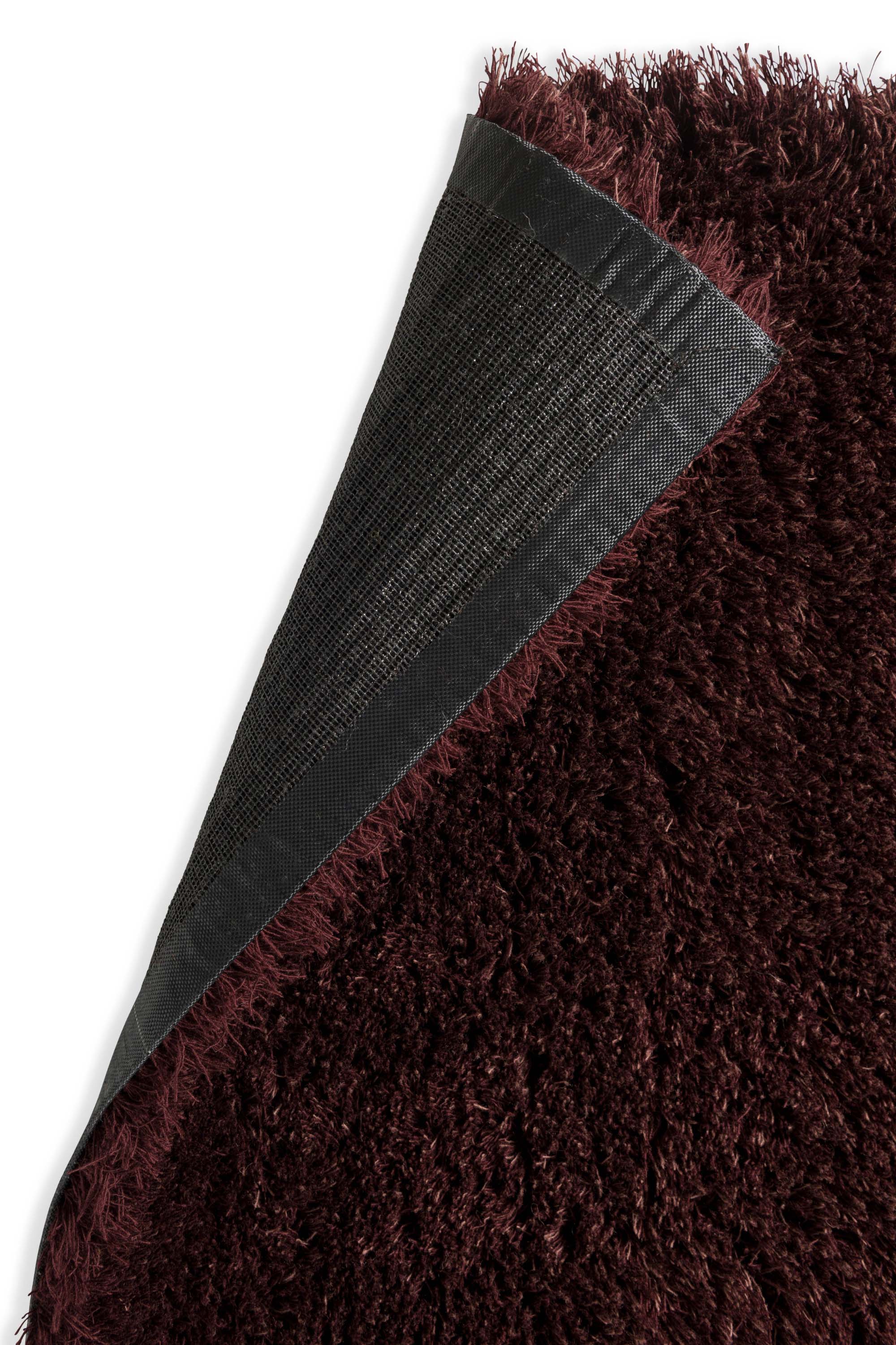 Plain red rug with shaggy pile