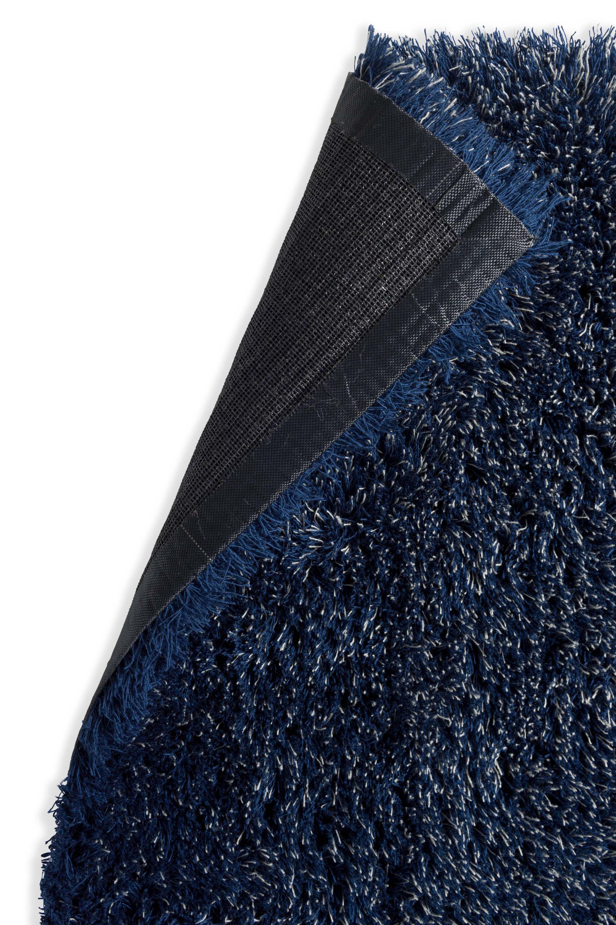 Plain blue rug with shaggy pile