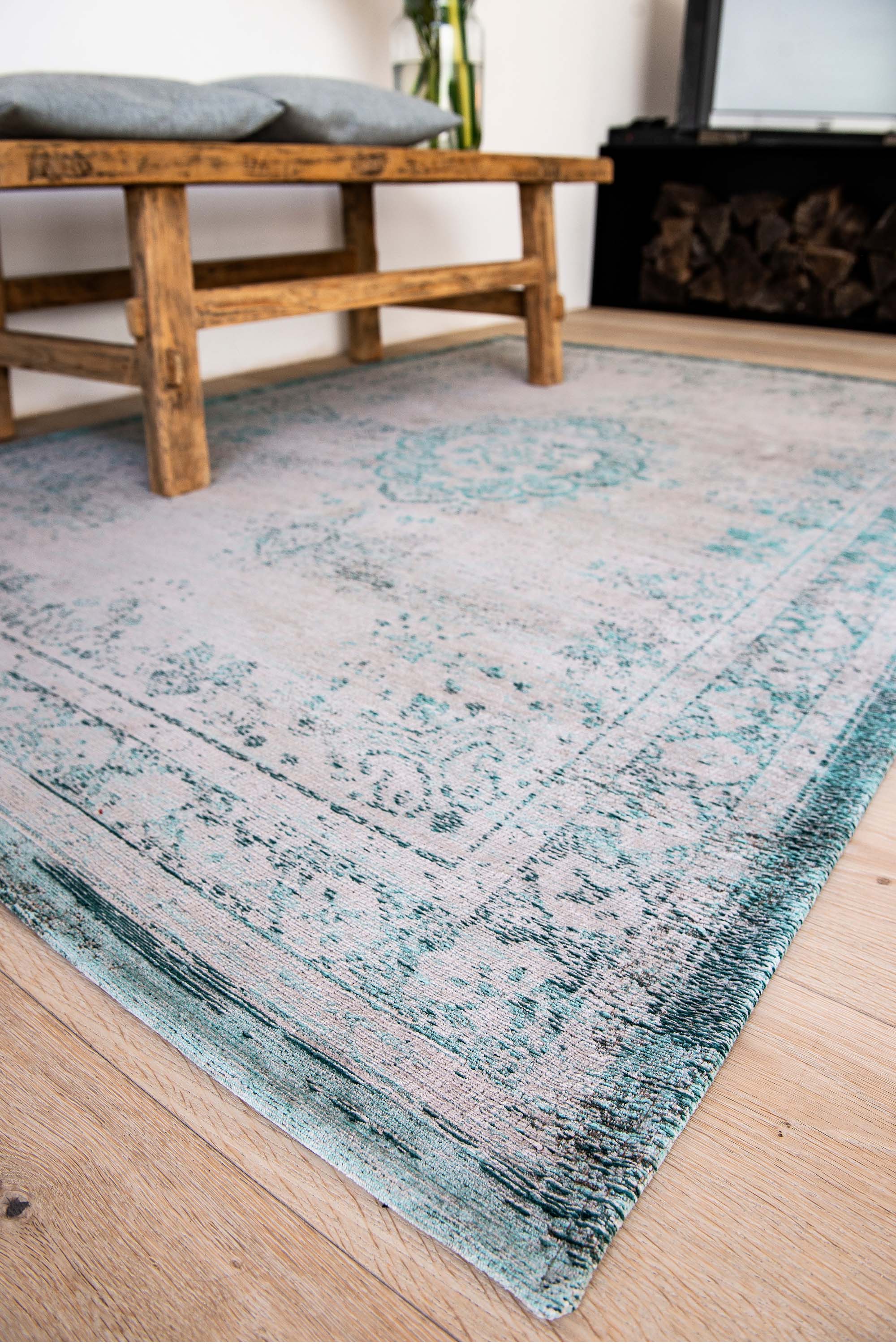 Grey flatweave rug with faded green persian design