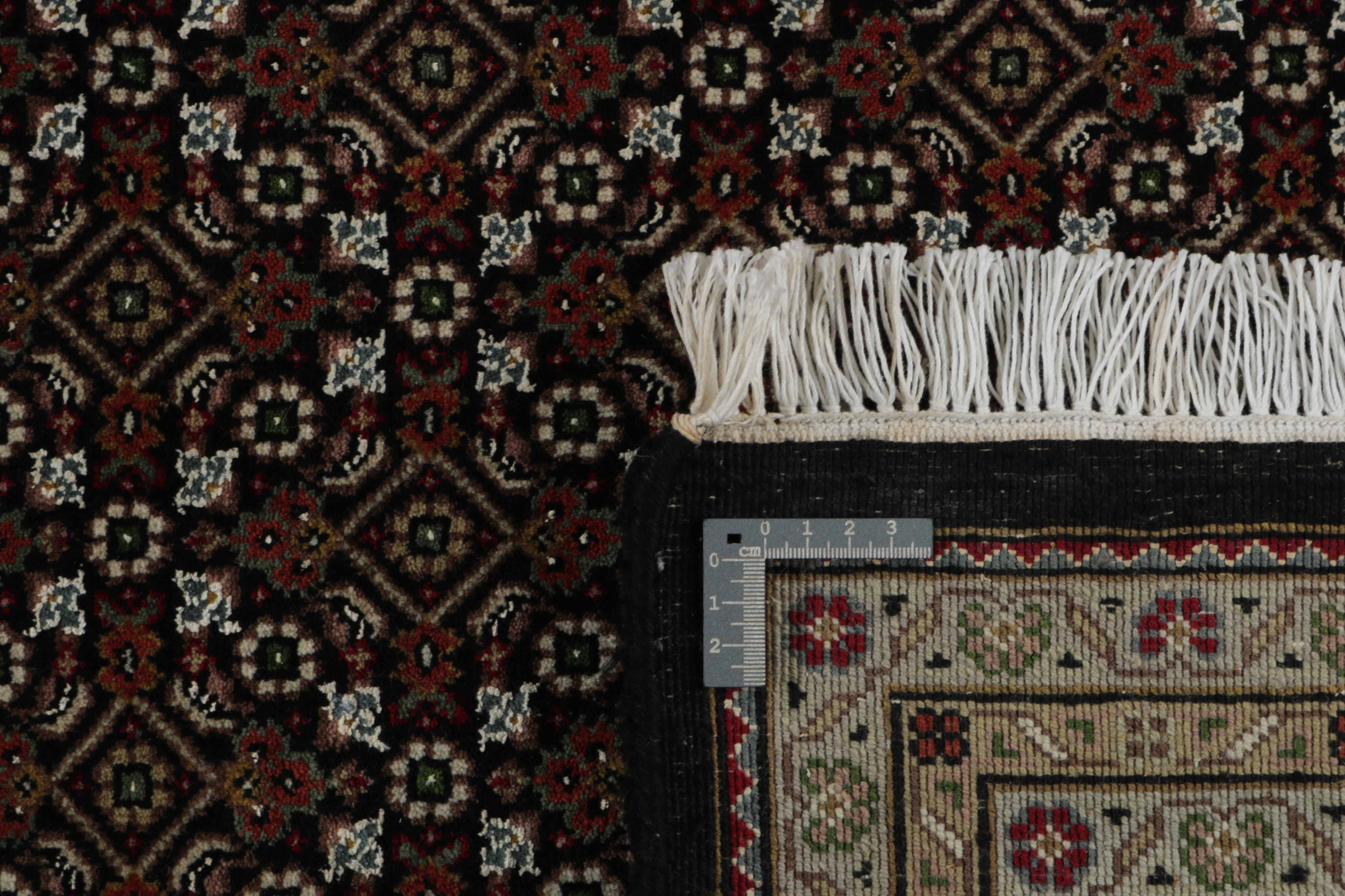 Authentic Oriental rug with traditional geometric and floral design in red