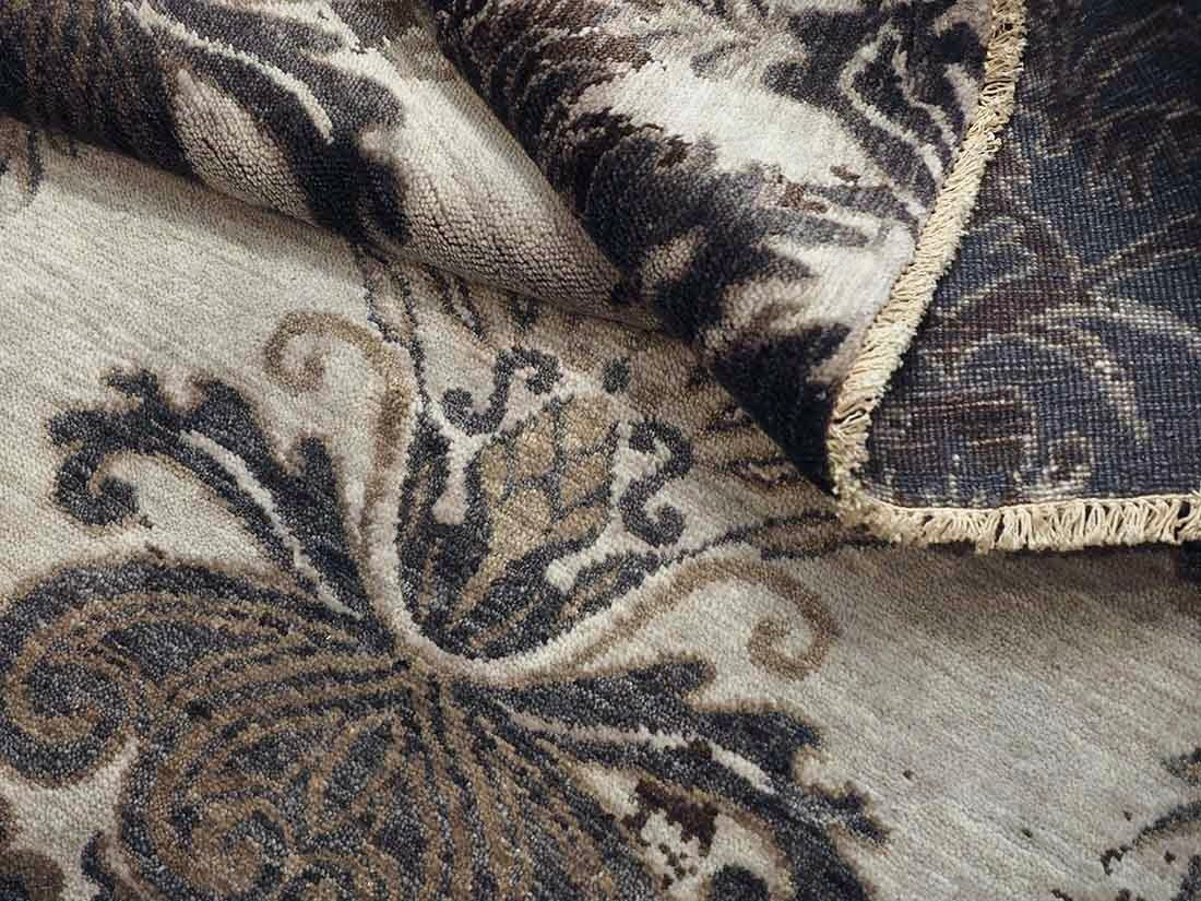 Authentic oriental rug with a damask pattern in beige and brown