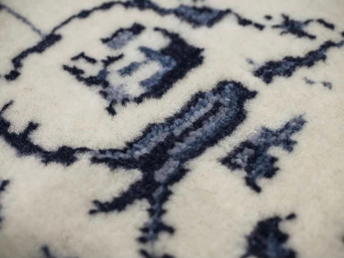 cream and blue oriental rug with a floral design