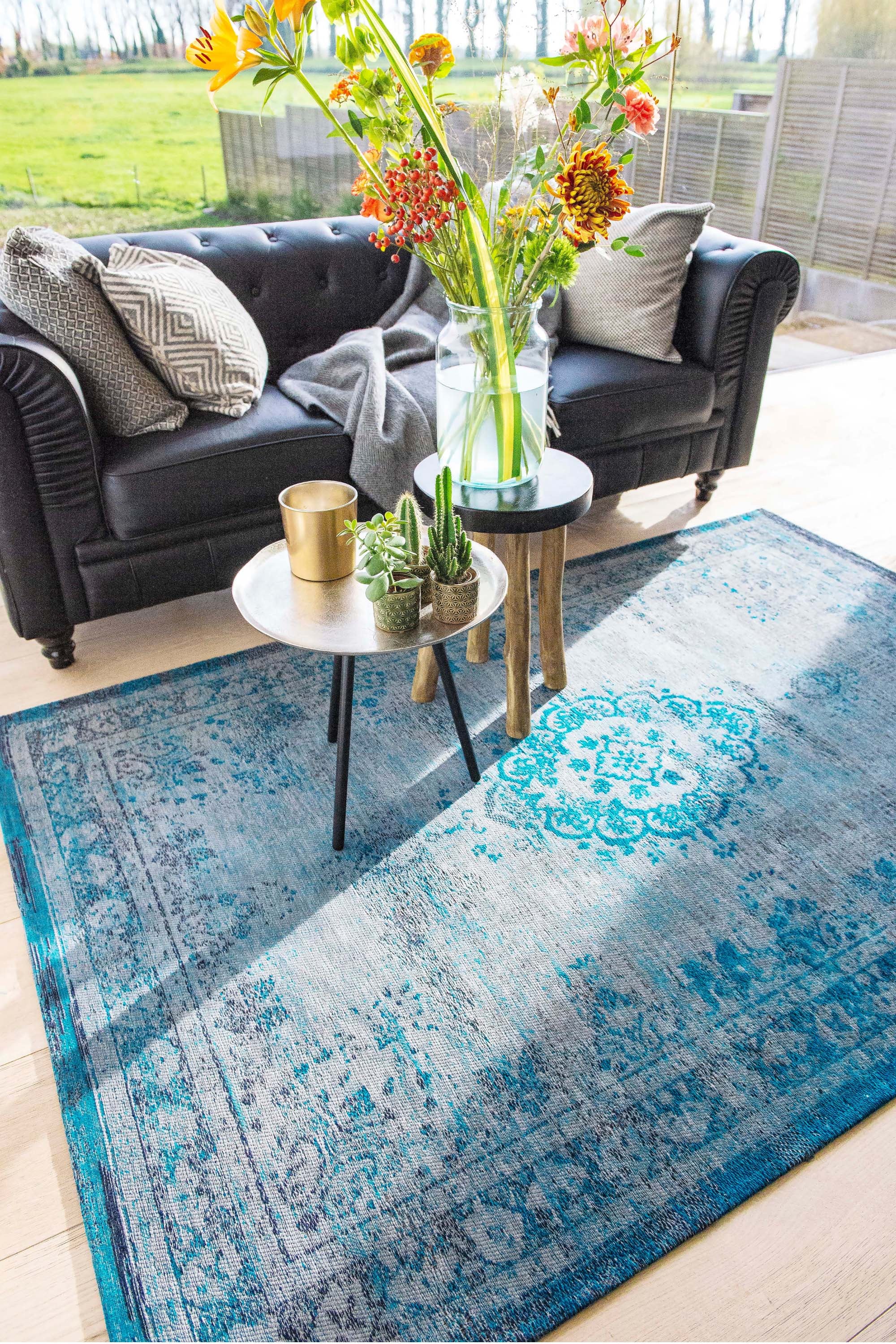 Grey and blue flatweave rug with faded persian design