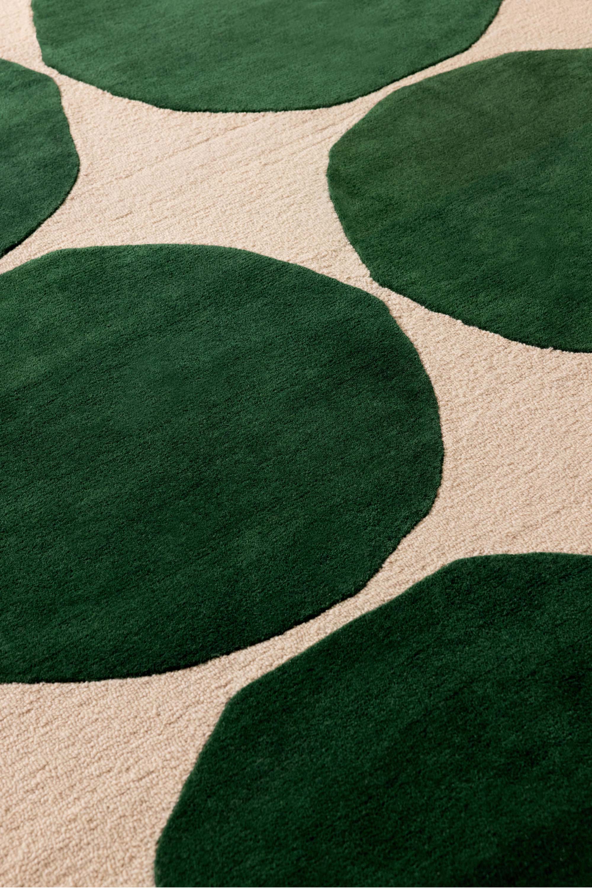 Beige rug with green repeated circle pattern