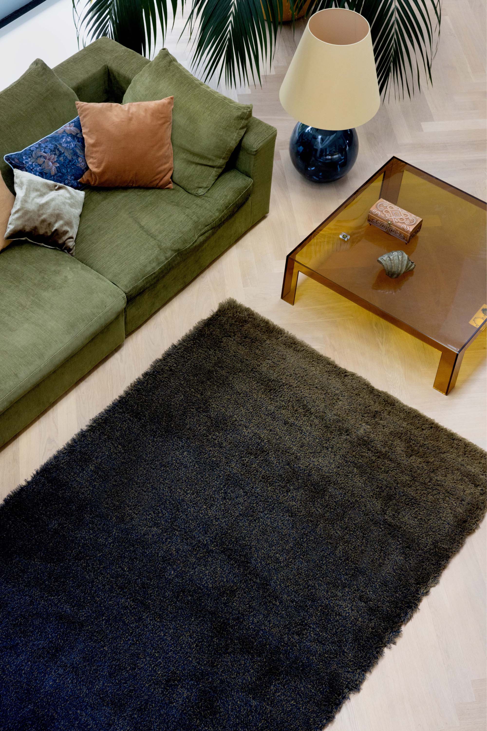 Plain green rug with shaggy pile