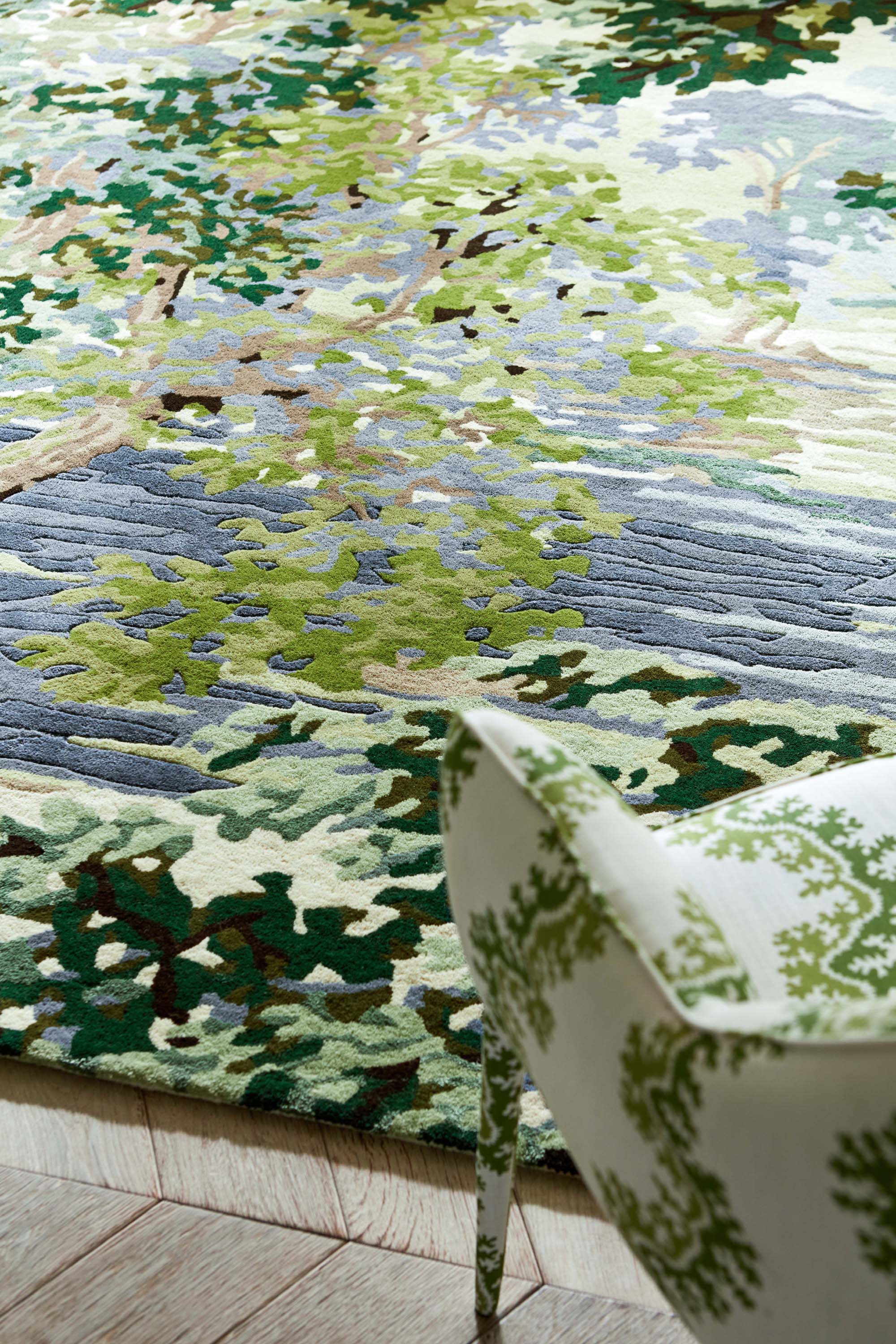 Green and blue floral rug with waterside pattern