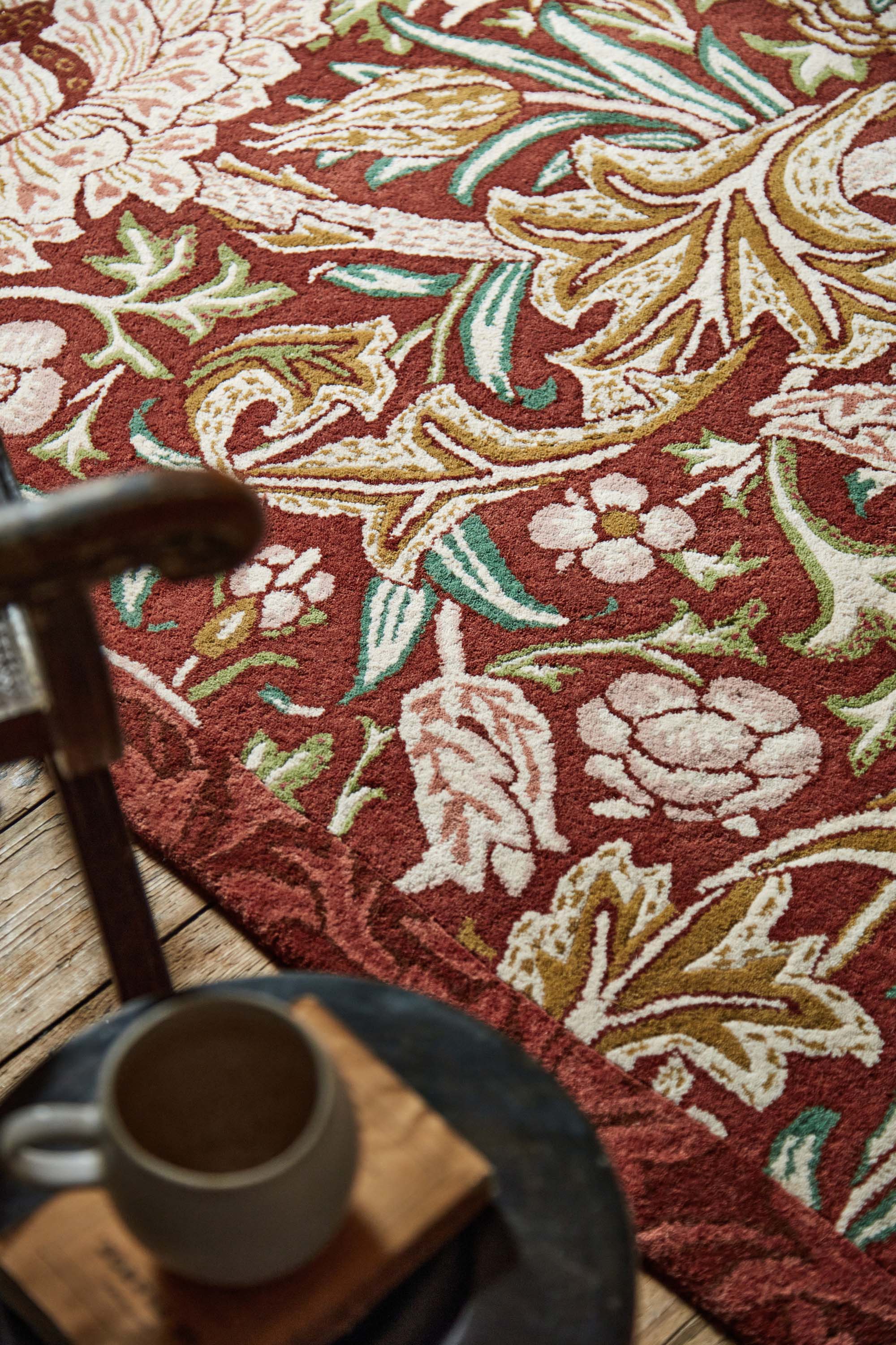Red floral bordered rug