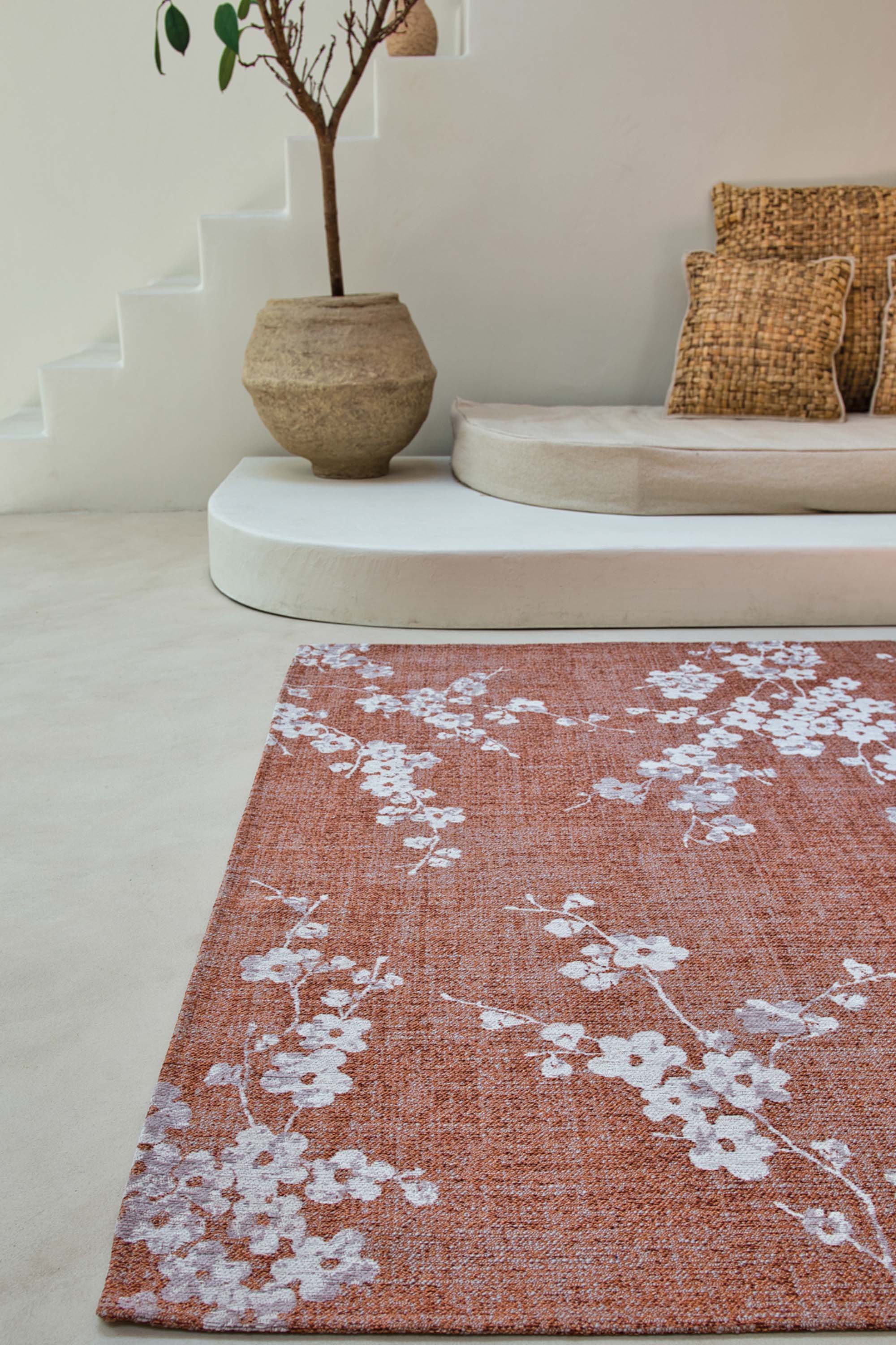 Modern abstract rug with subtle pink floral pattern