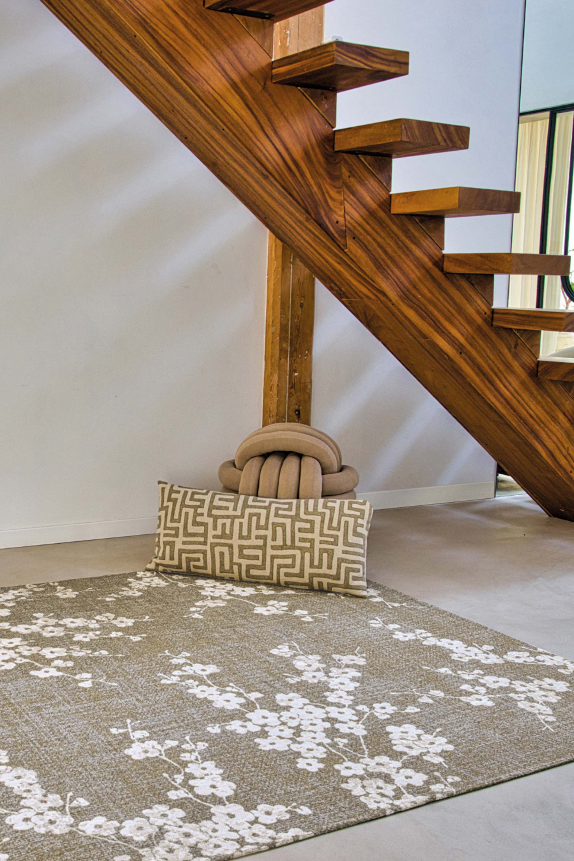 Modern abstract rug with subtle green floral pattern