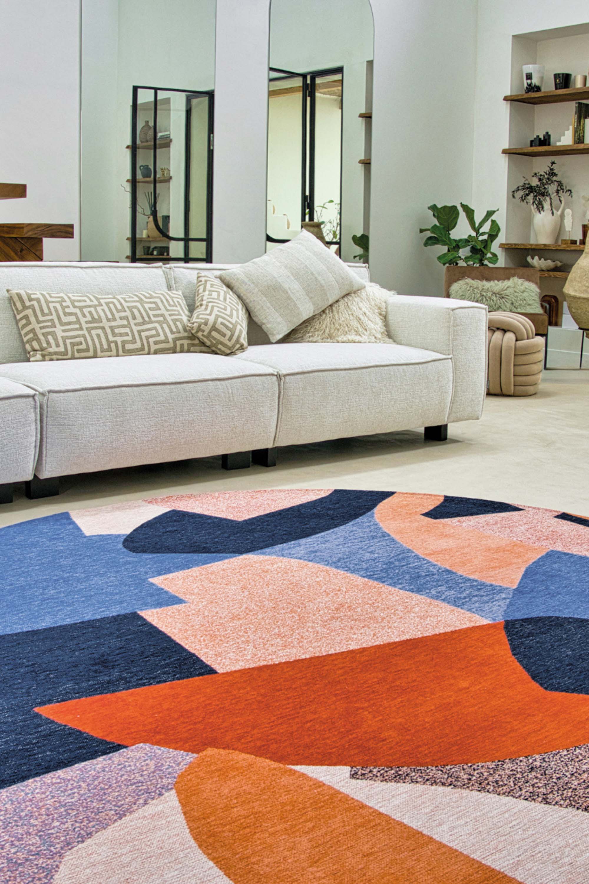 Modern circle rug with red and blue abstract pattern