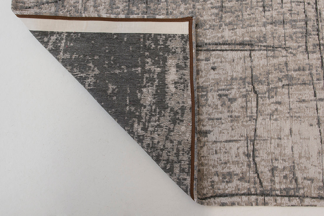 White flatweave rug with grey abstract pattern
