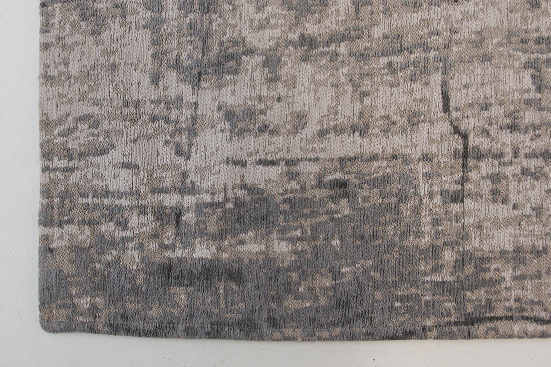 White flatweave rug with grey abstract pattern