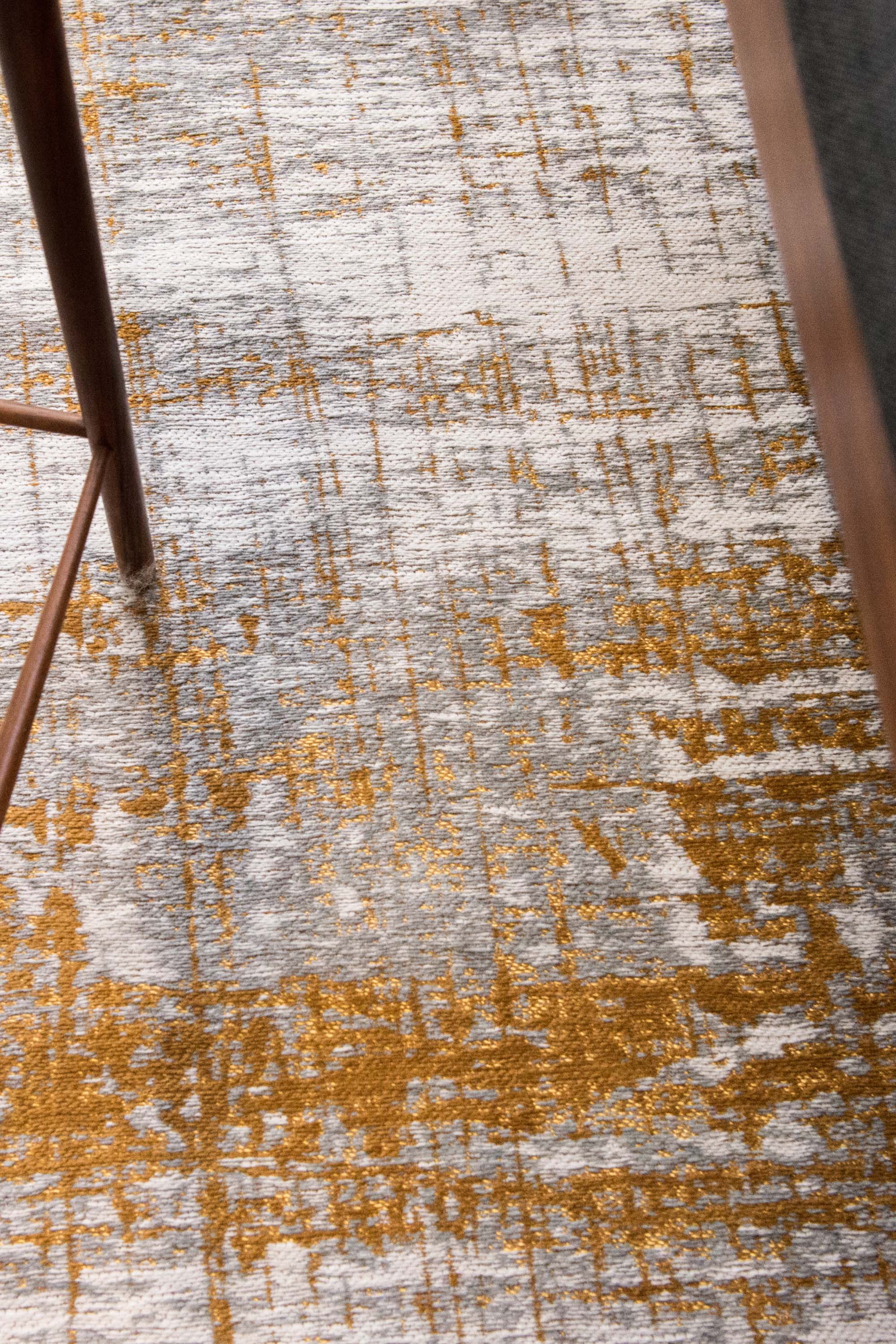 White flatweave rug with grey and yellow abstract pattern