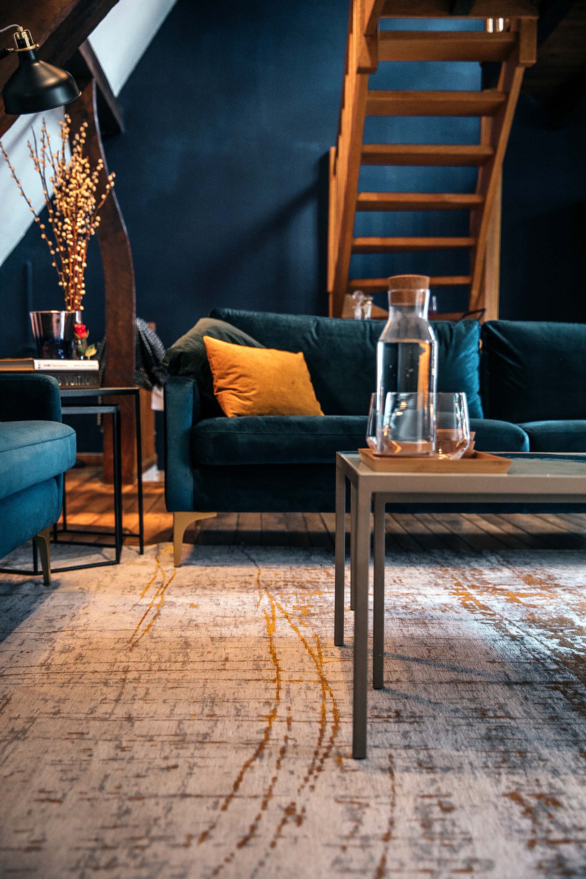 White flatweave rug with grey and yellow abstract pattern
