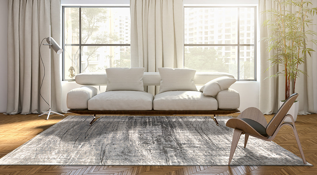 White flatweave rug with grey abstract pattern