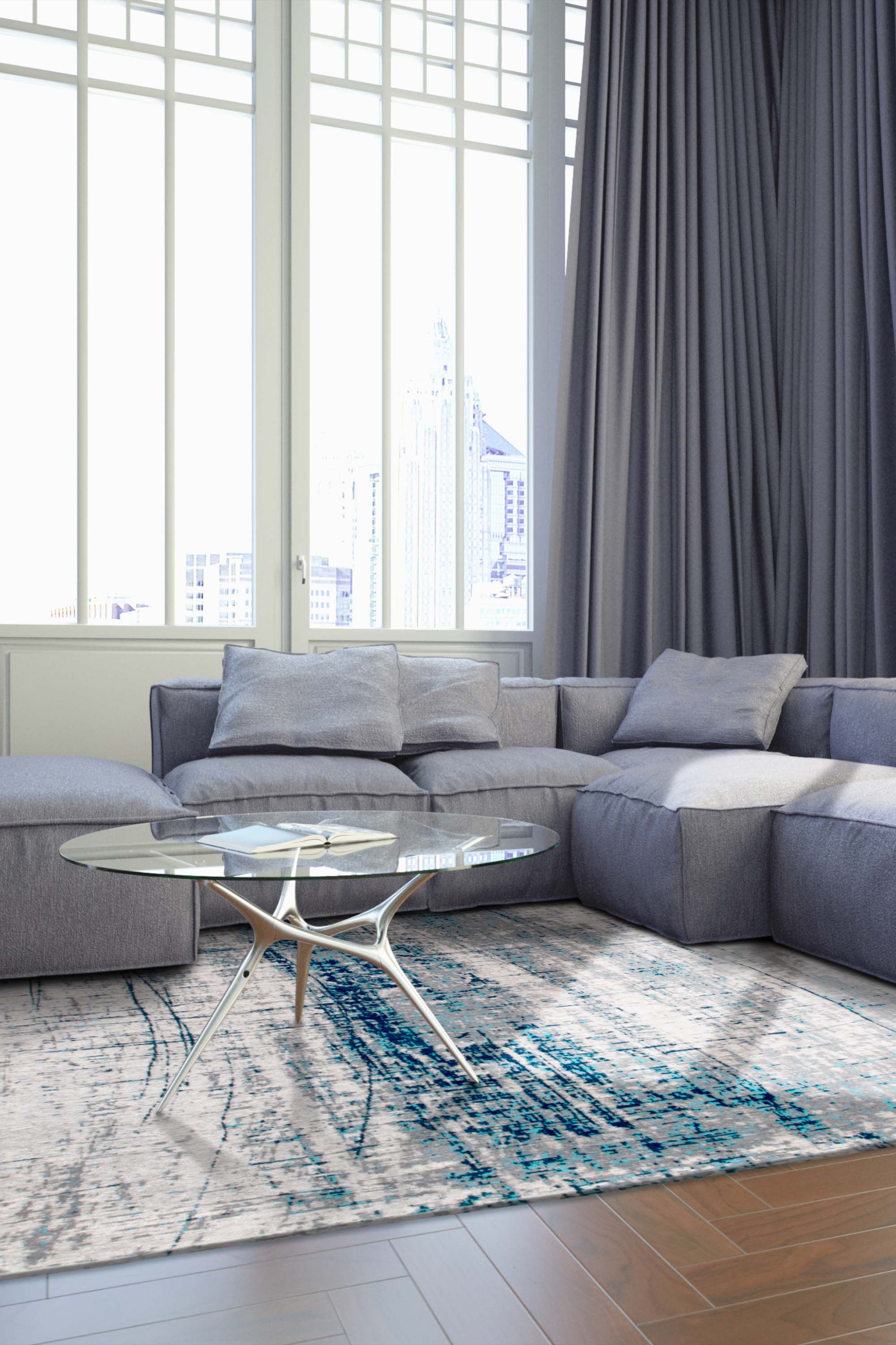 White flatweave rug with grey and blue abstract pattern