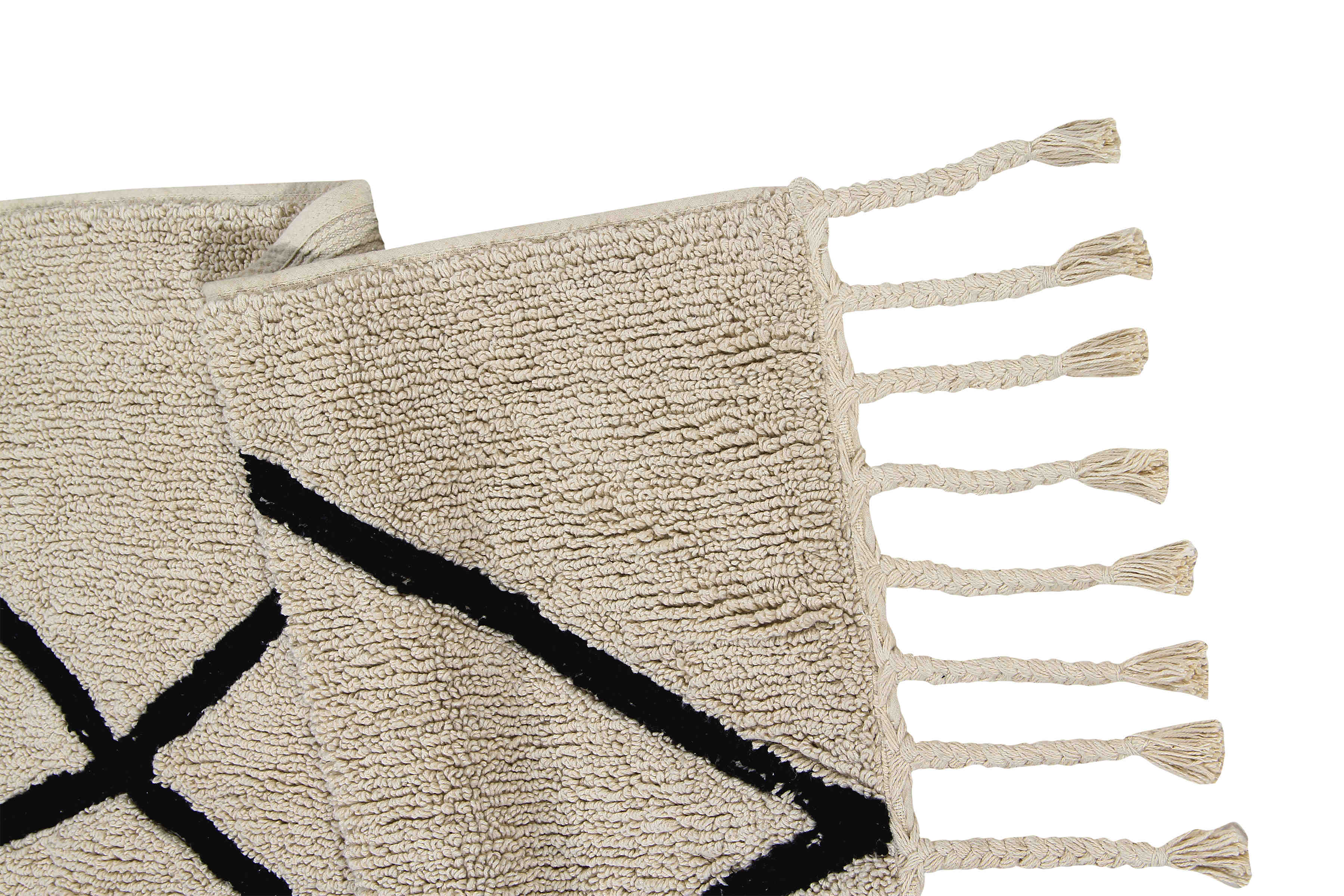 Rectangular beige cotton rug decorated with a black geometric tribal design and braided border