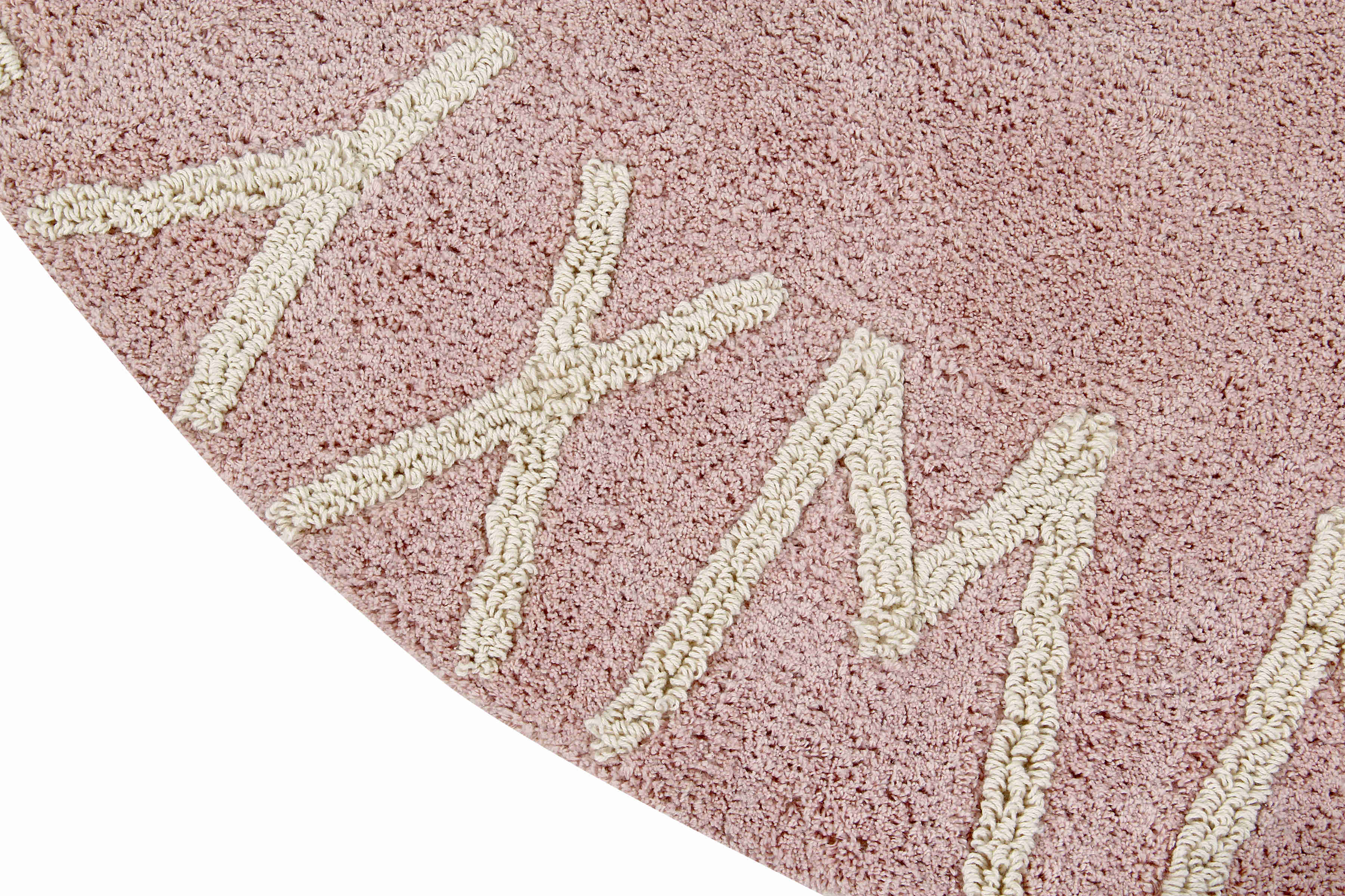 Circular pink cotton rug decorated with a natural beige alphabet border