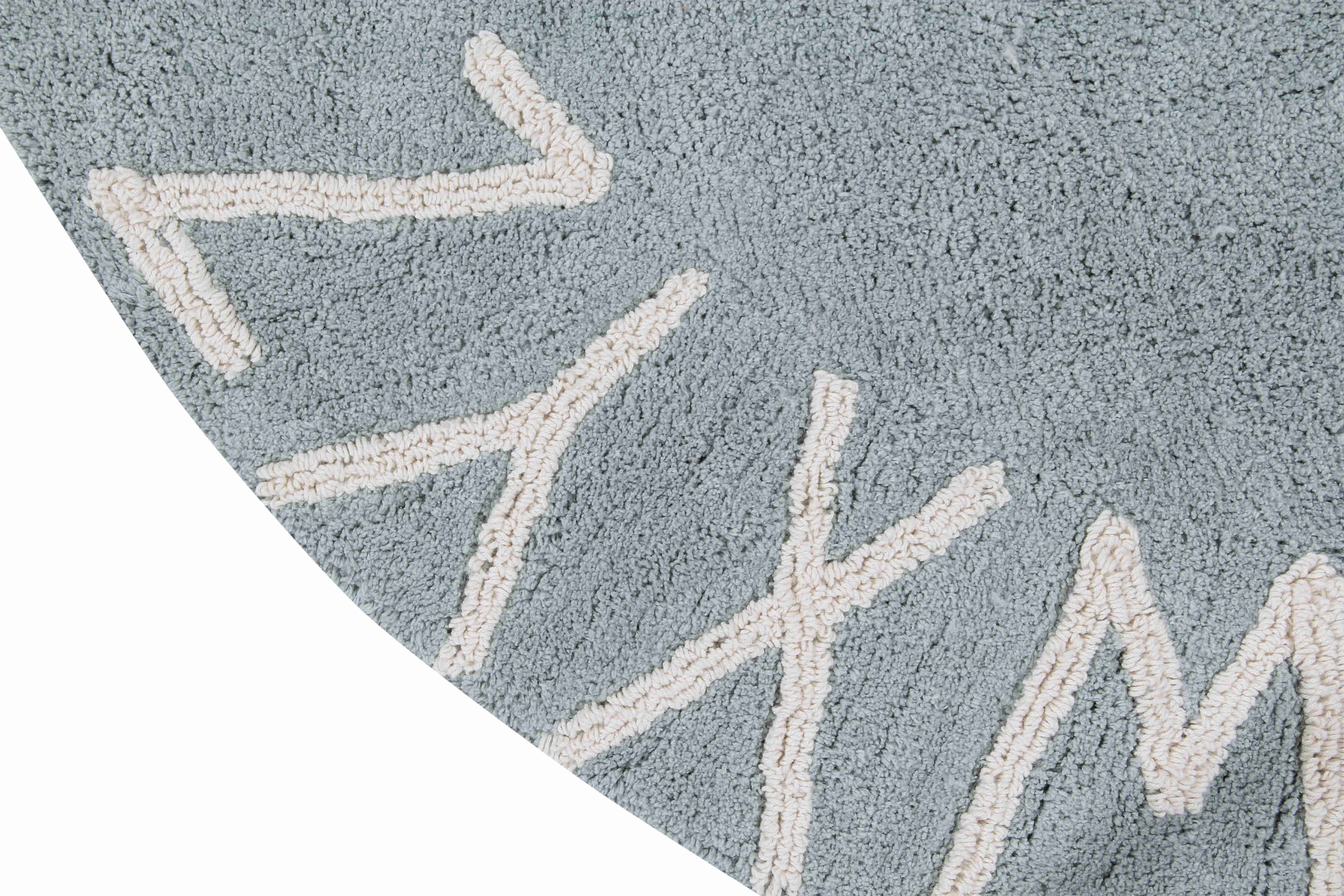 Circular blue cotton rug decorated with a natural beige alphabet border