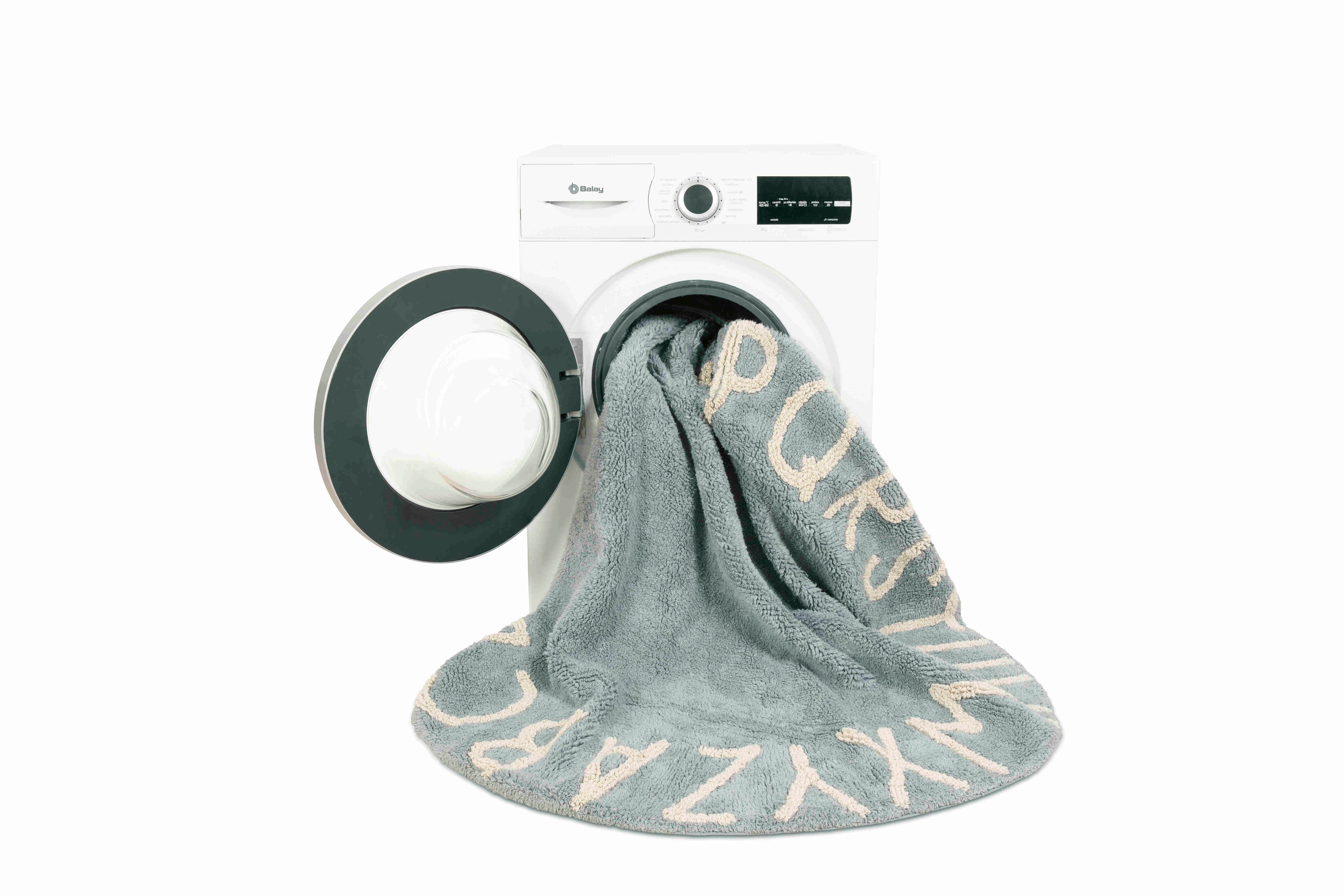 Circular blue cotton rug decorated with a natural beige alphabet border