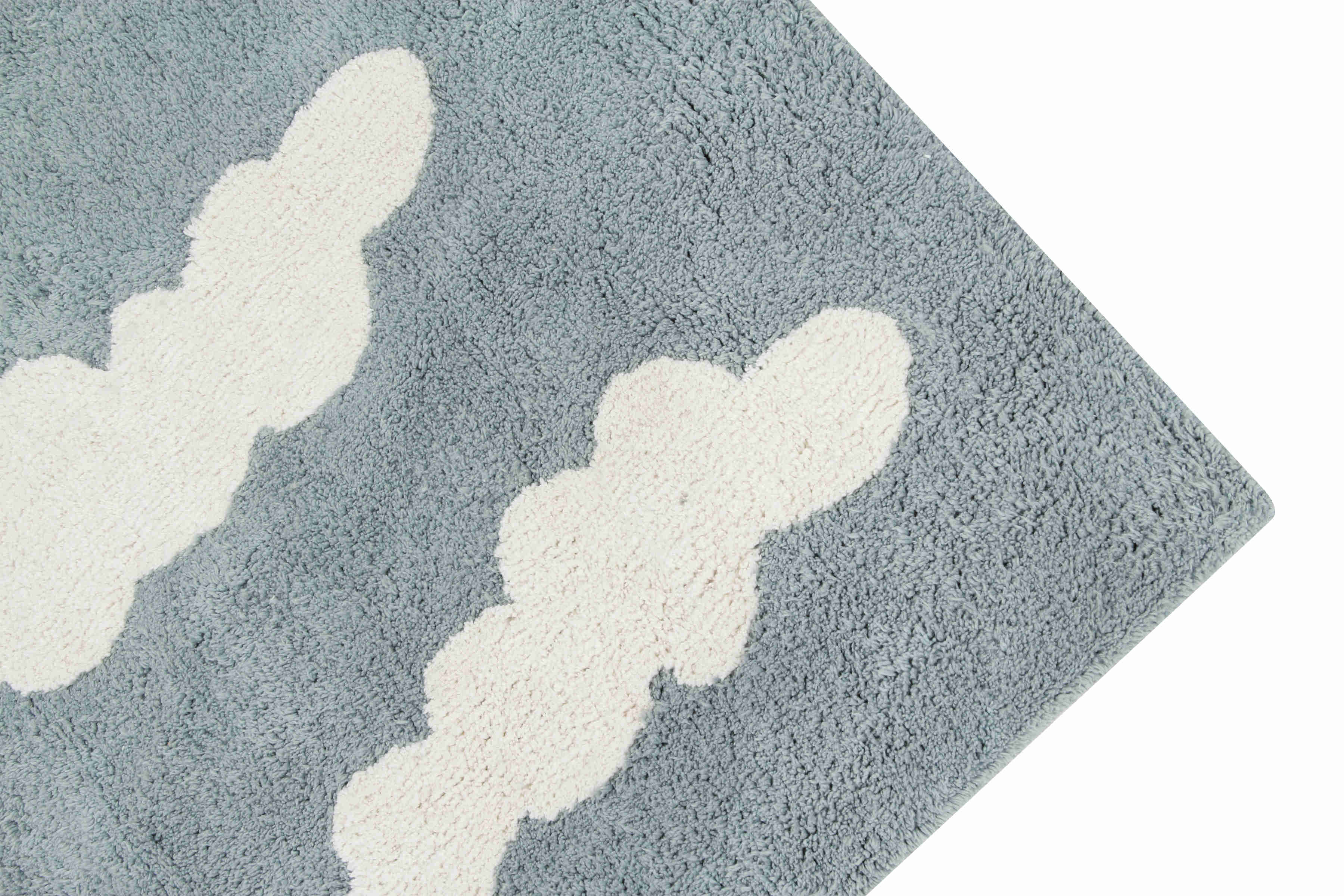 Rectangular blue cotton rug with white cloud design