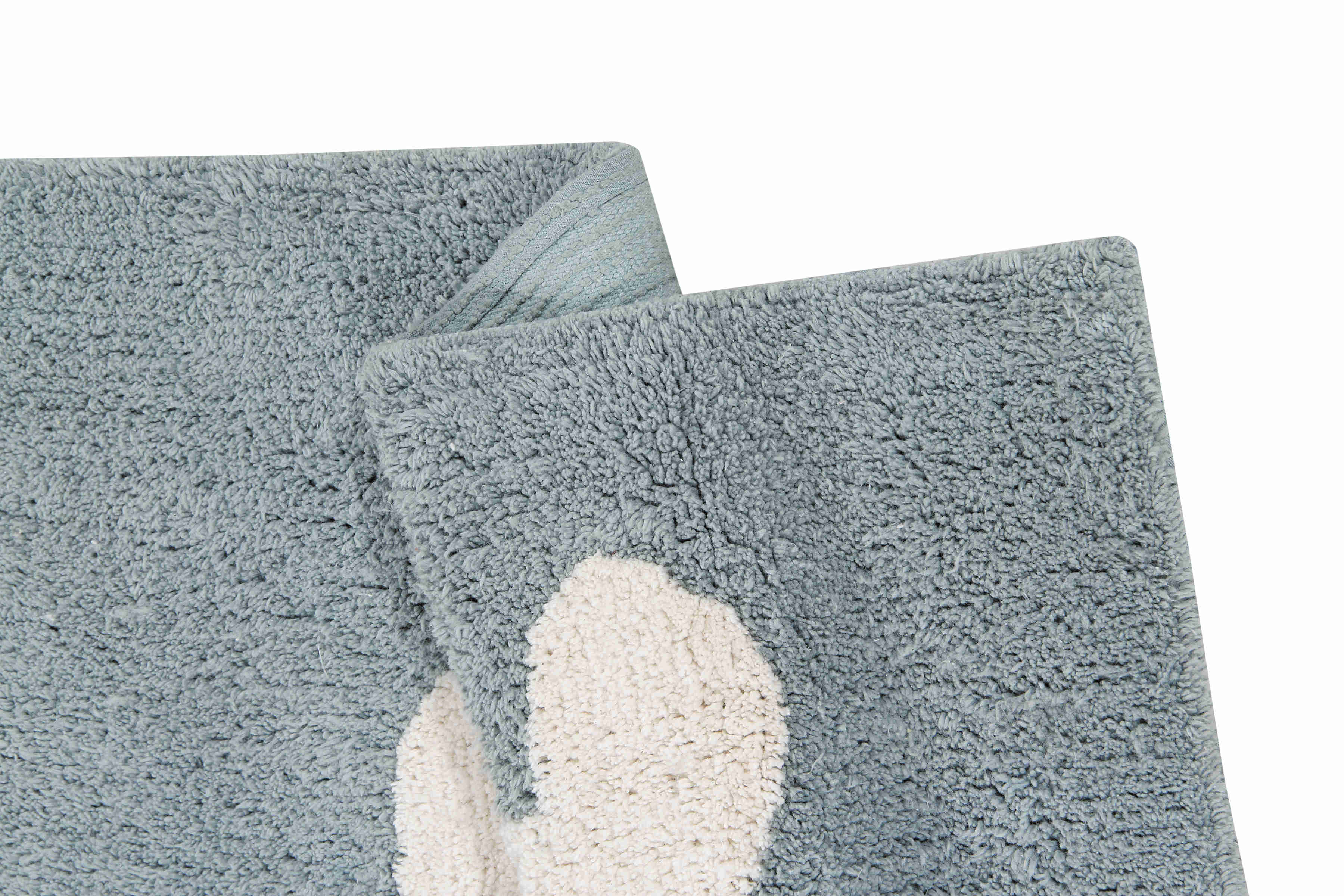 Rectangular blue cotton rug with white cloud design