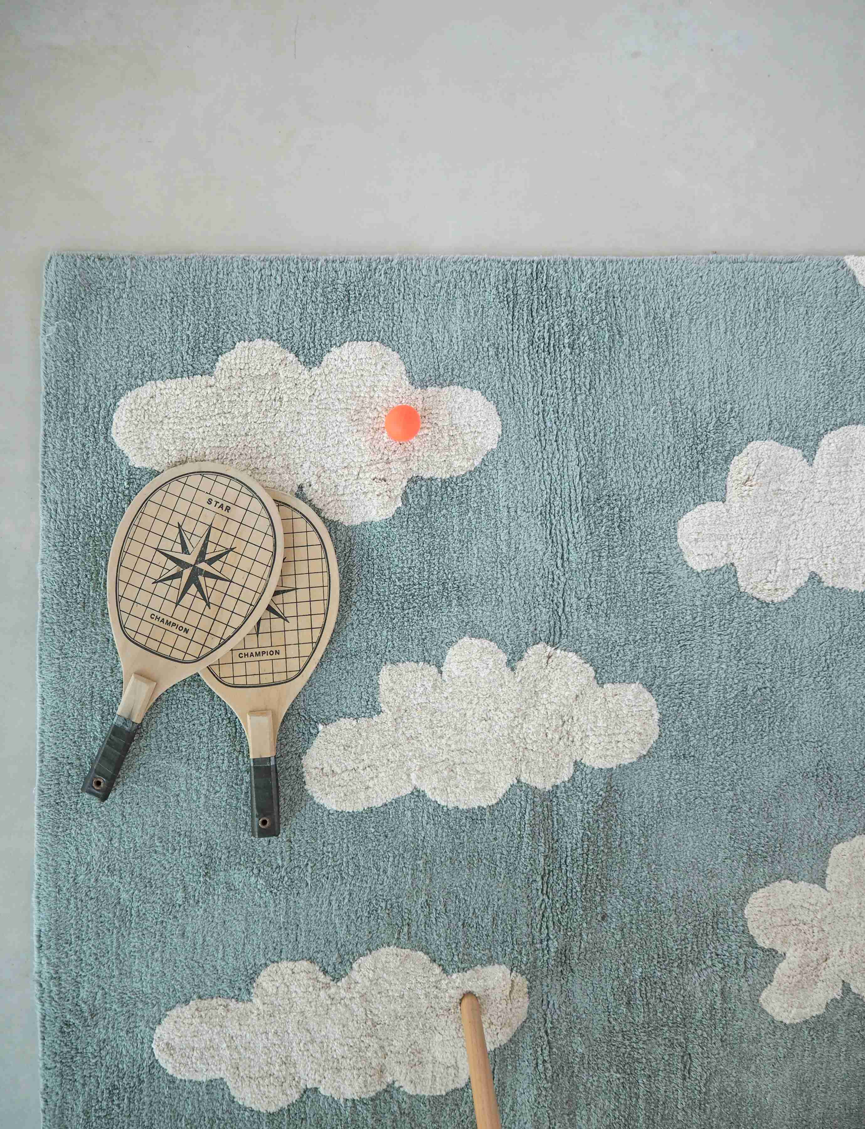 Rectangular blue cotton rug with white cloud design
