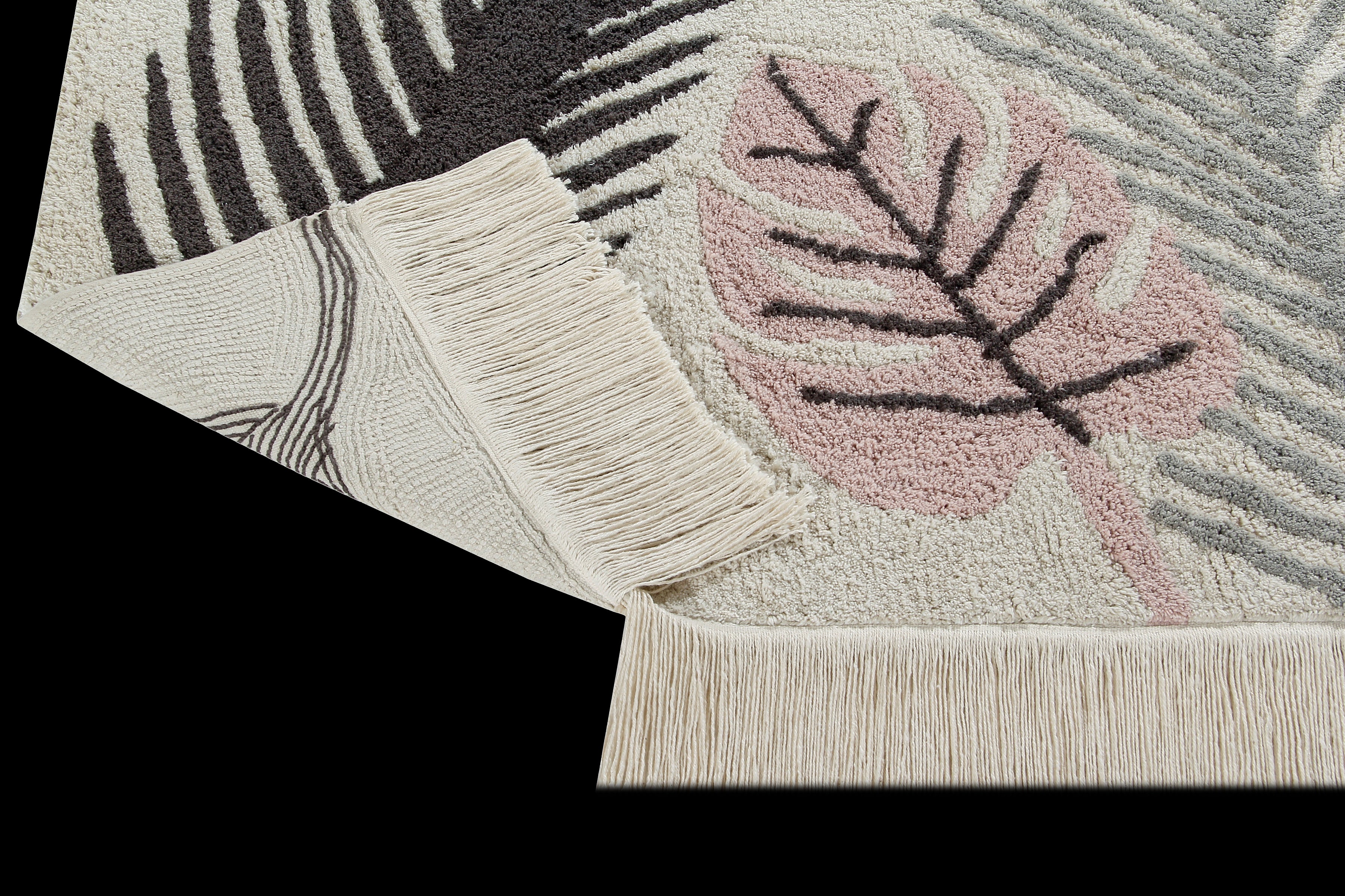 Rectangular beige cotton rug decorated with large pink and green leaves and a fringed border