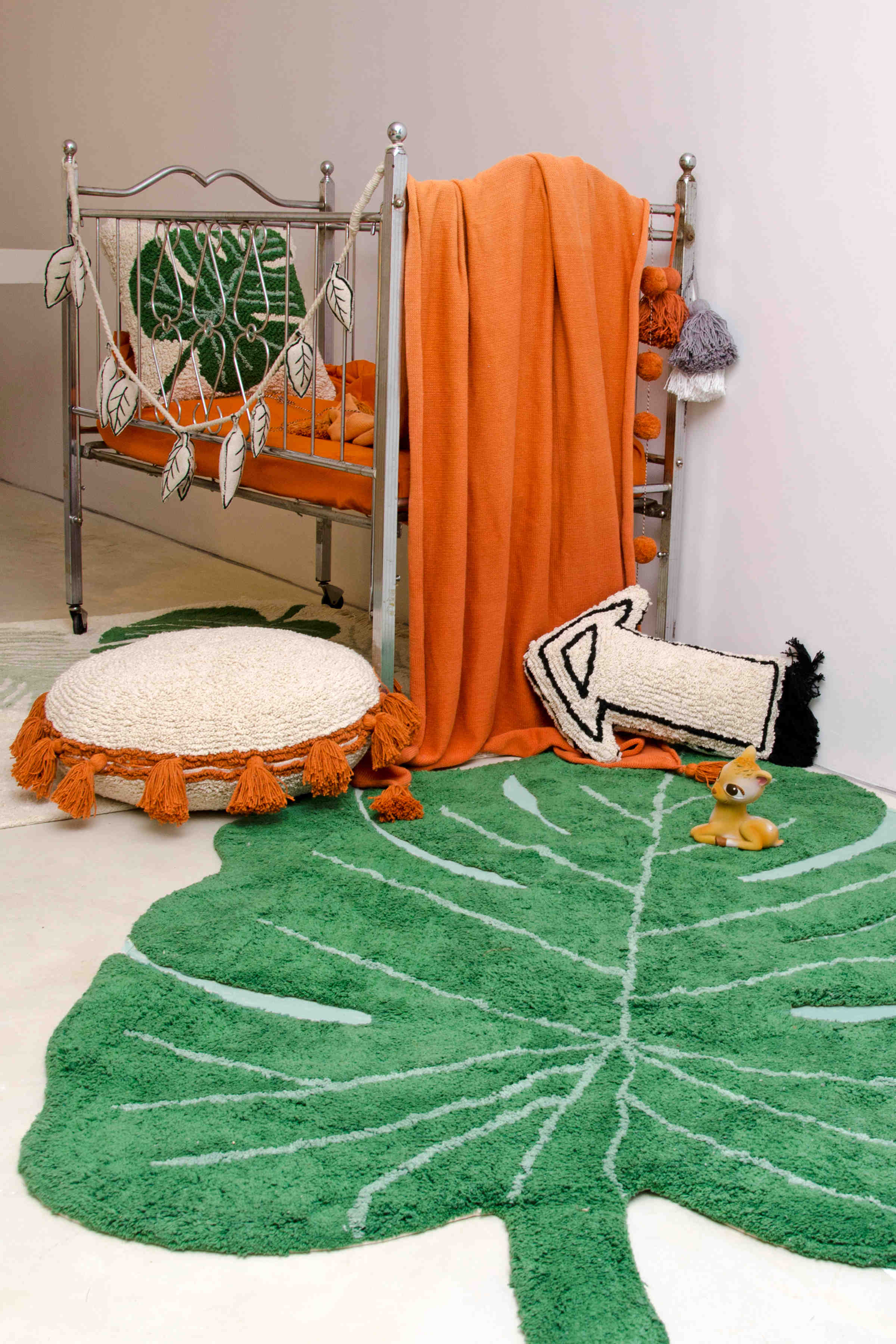 A large green leaf-shaped rug