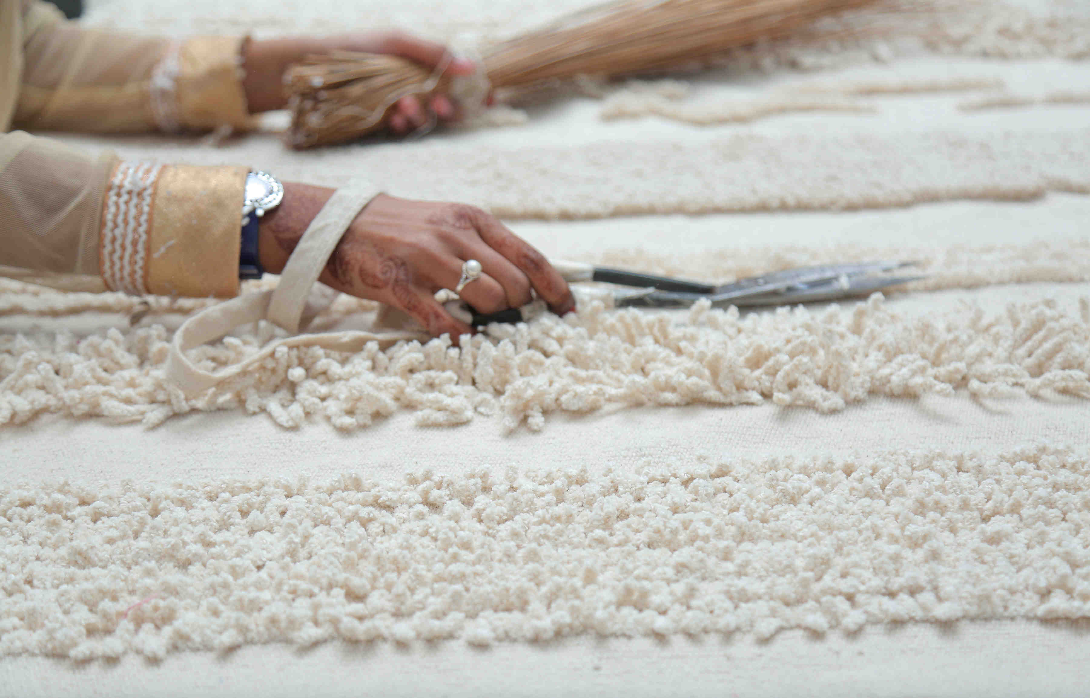Rectangular natural beige rug decorated with a raised textured stripe pattern