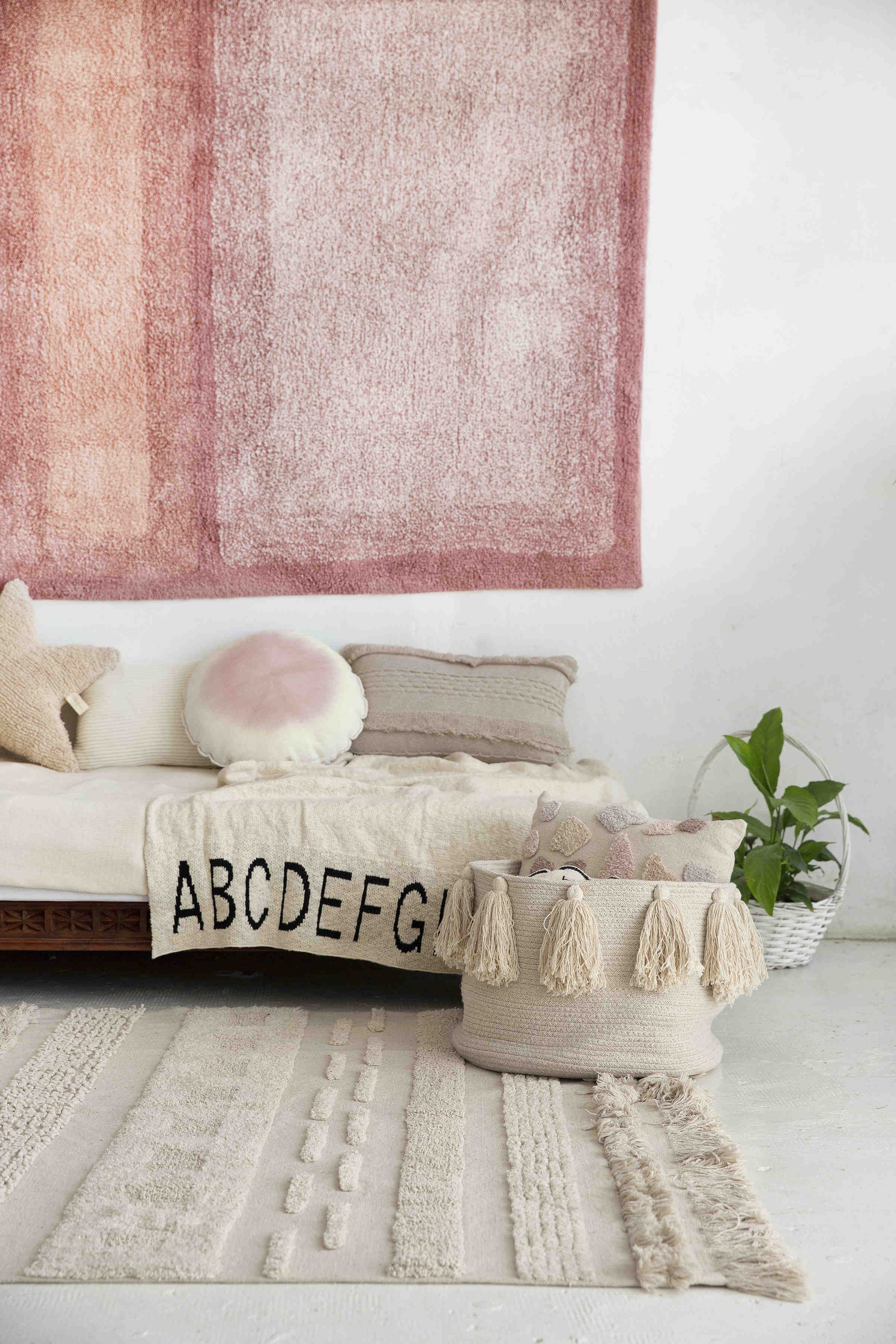 Rectangular natural beige rug decorated with a raised textured stripe pattern