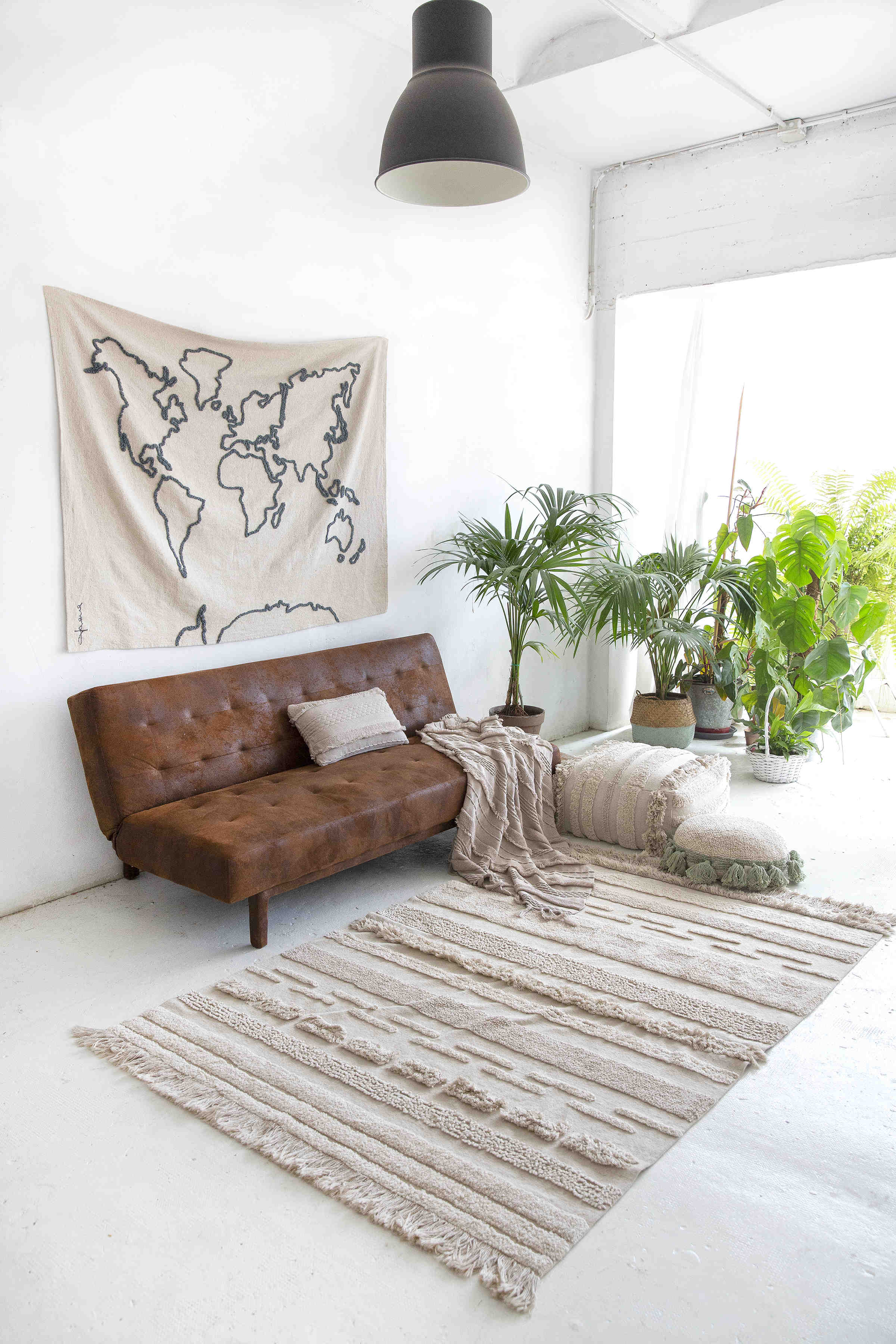 Rectangular natural beige rug decorated with a raised textured stripe pattern