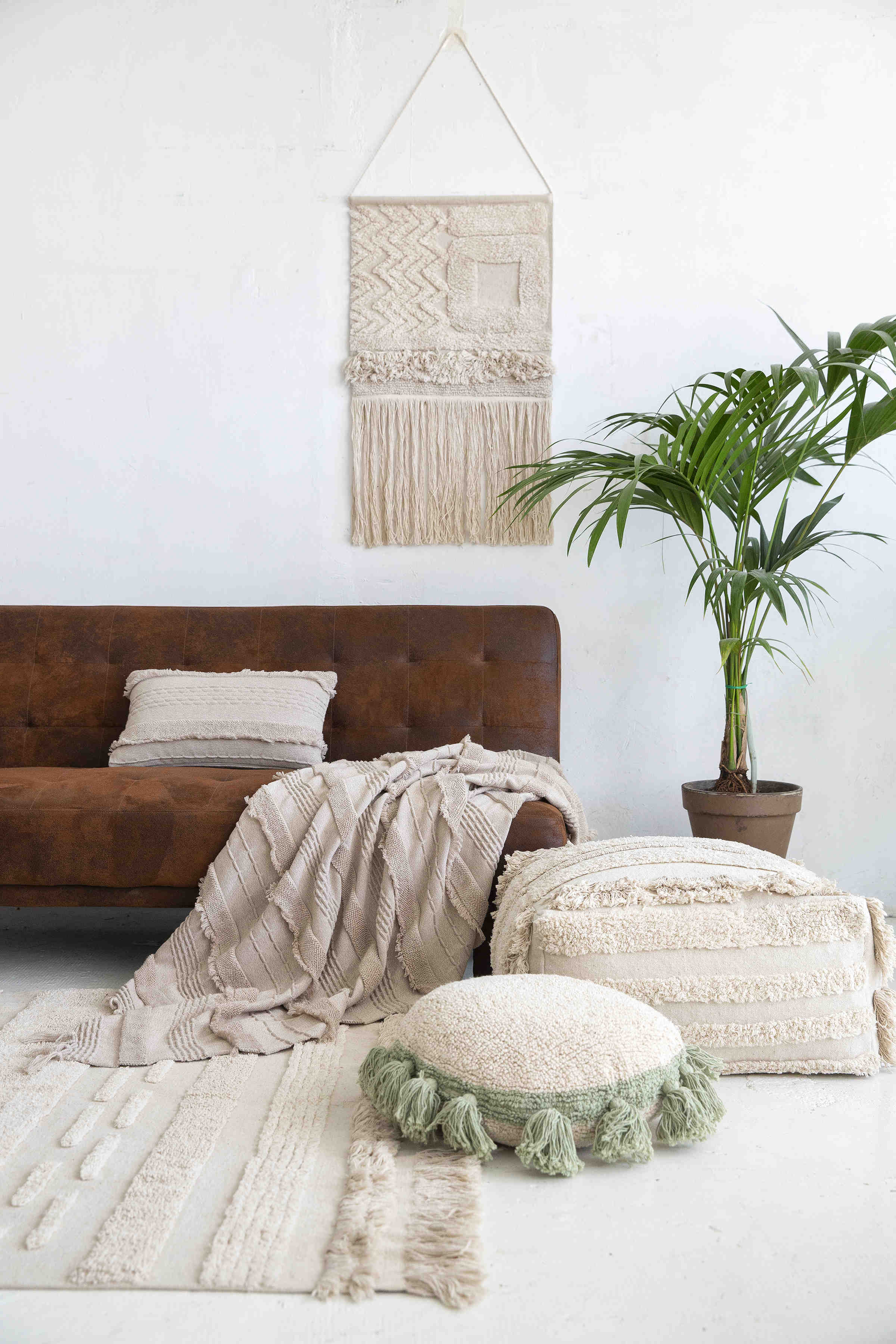 Rectangular natural beige rug decorated with a raised textured stripe pattern