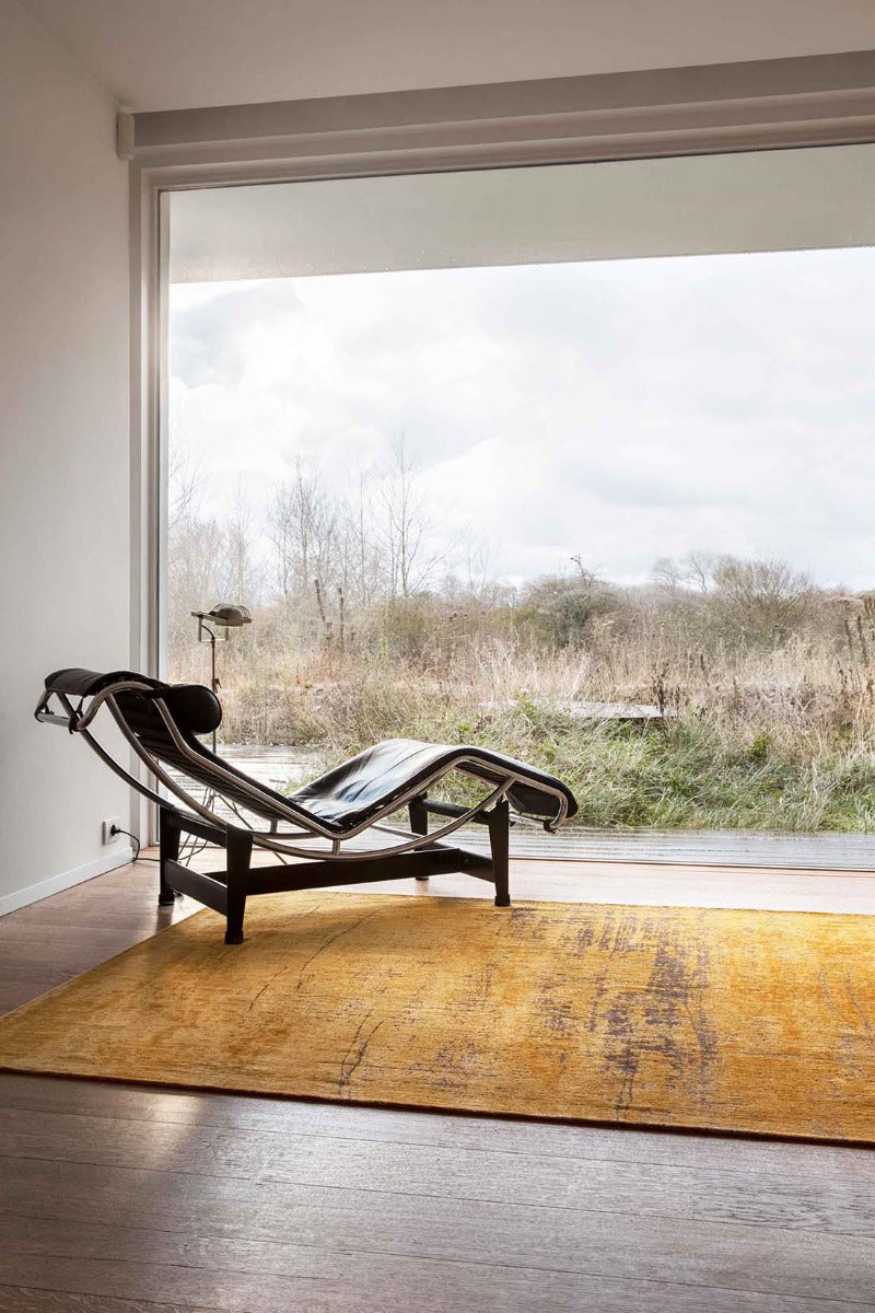 gold flatweave area rug with abstract design