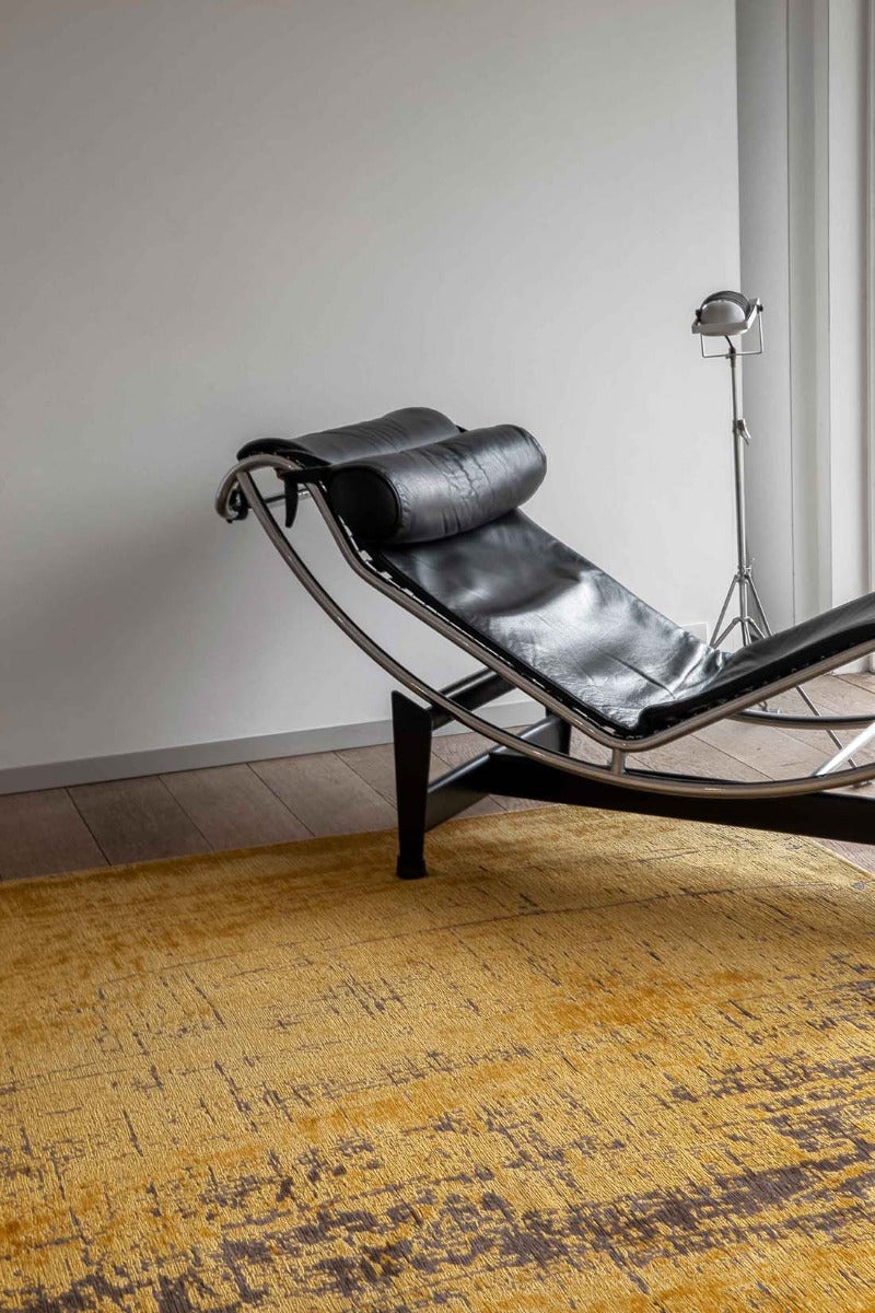 gold flatweave area rug with abstract design