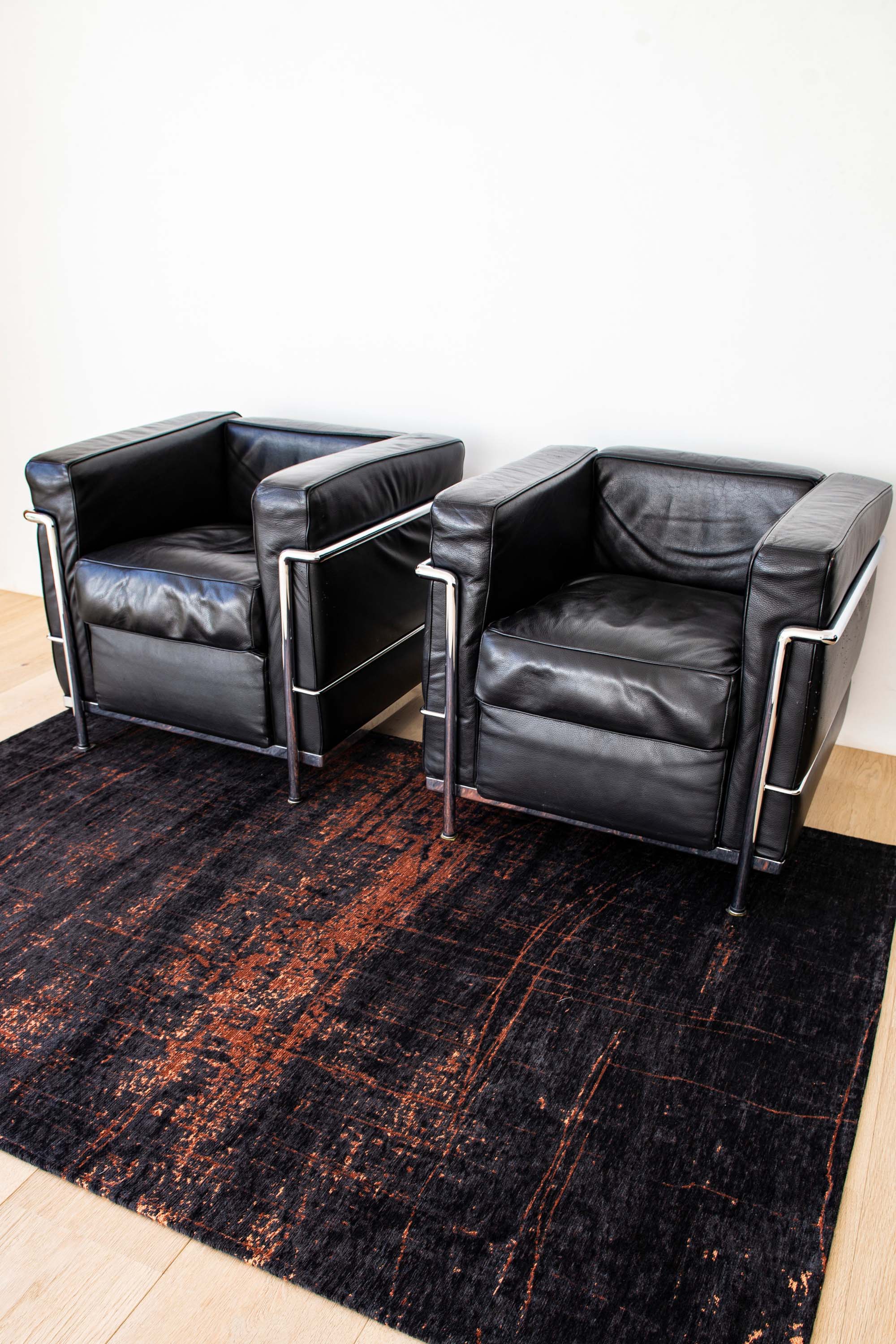 Black flatweave rug with copper brown abstract pattern