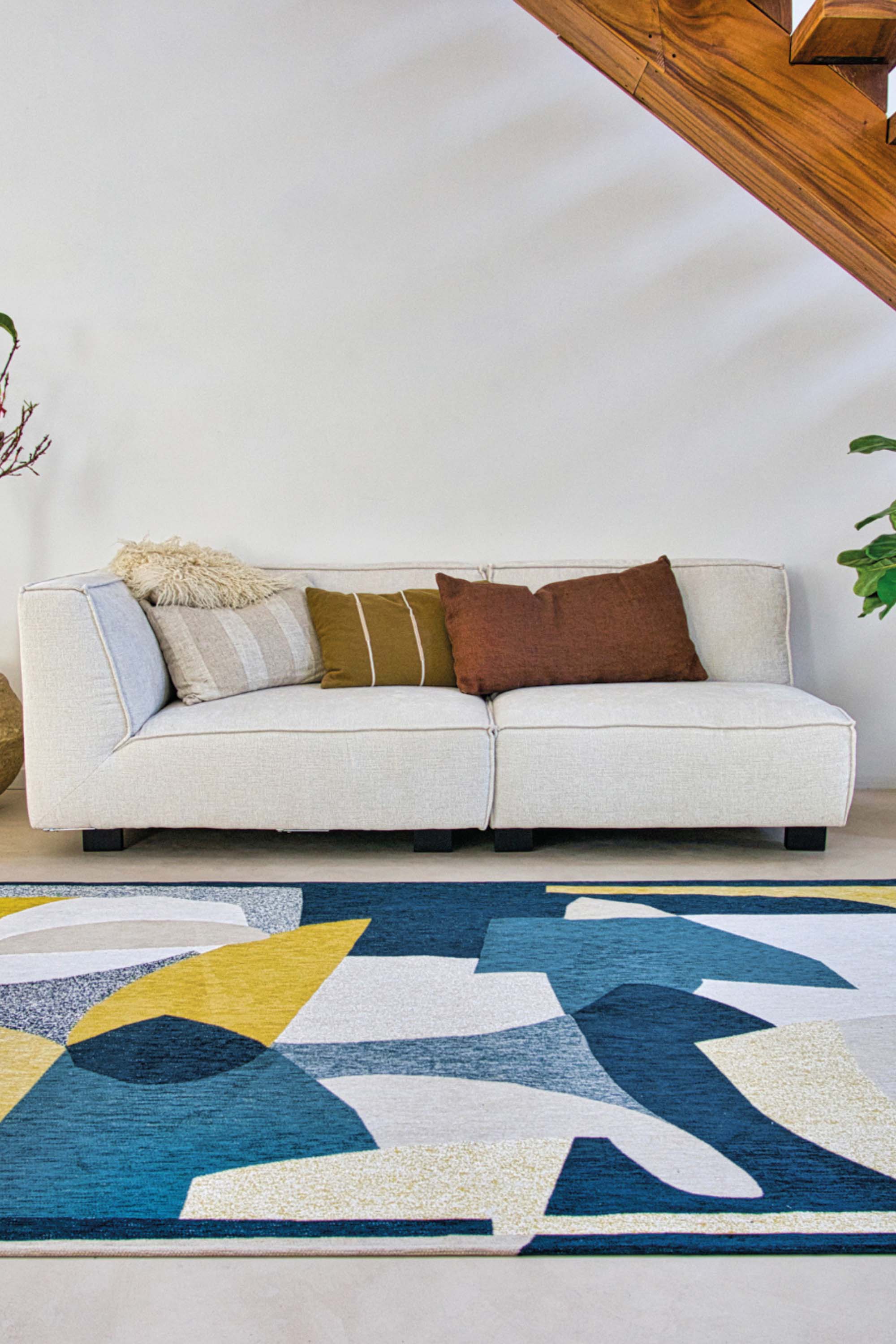 Modern rug with blue and yellow abstract pattern