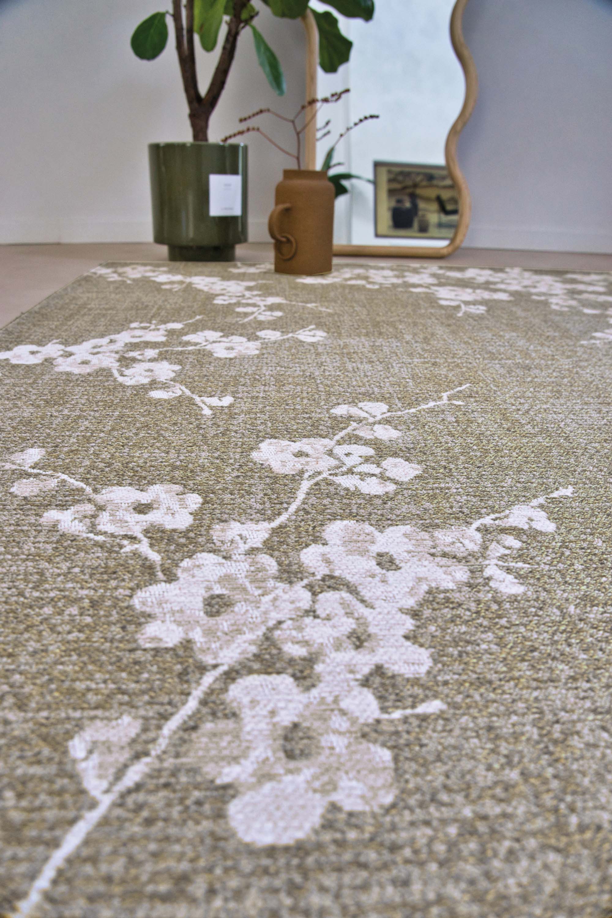 Modern abstract rug with subtle green floral pattern