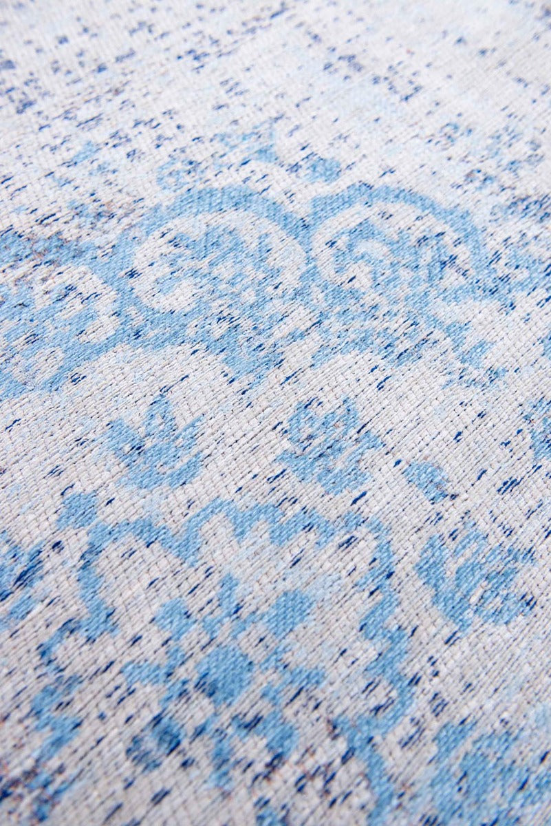 blue and grey flatweave rug with traditional medallion design