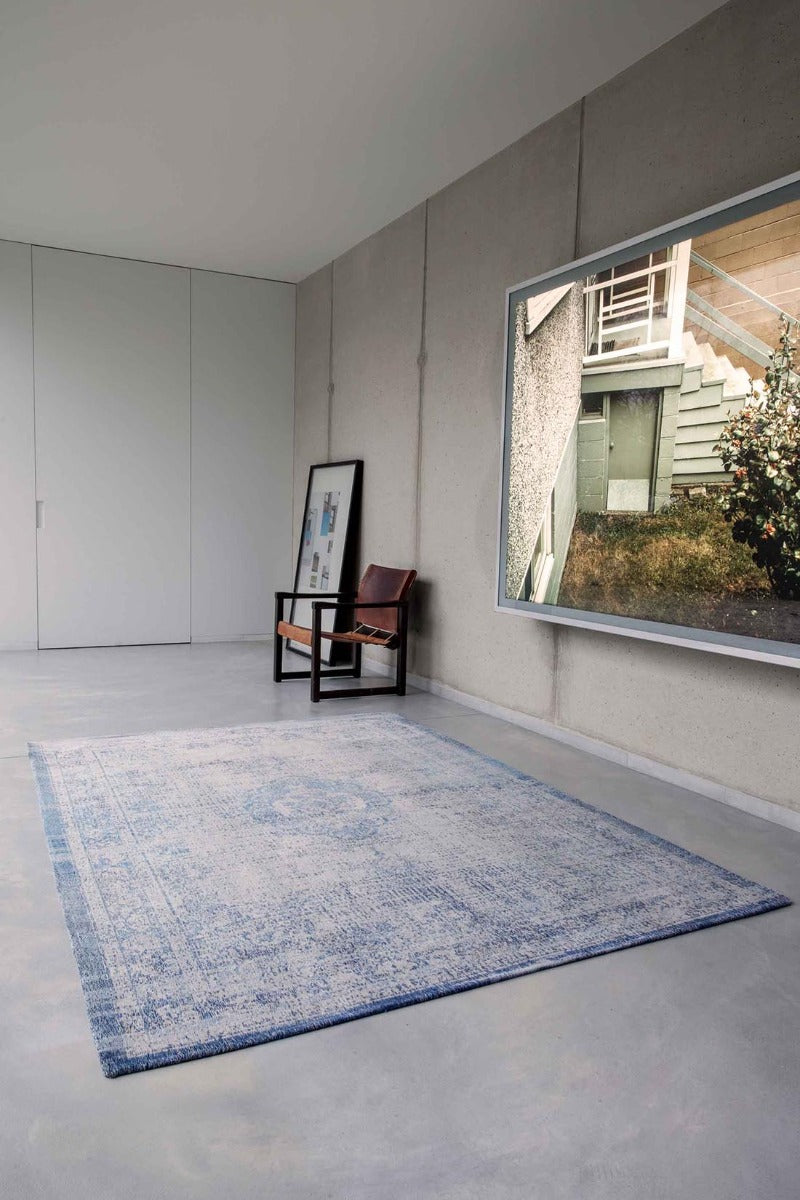 blue and grey flatweave rug with traditional medallion design